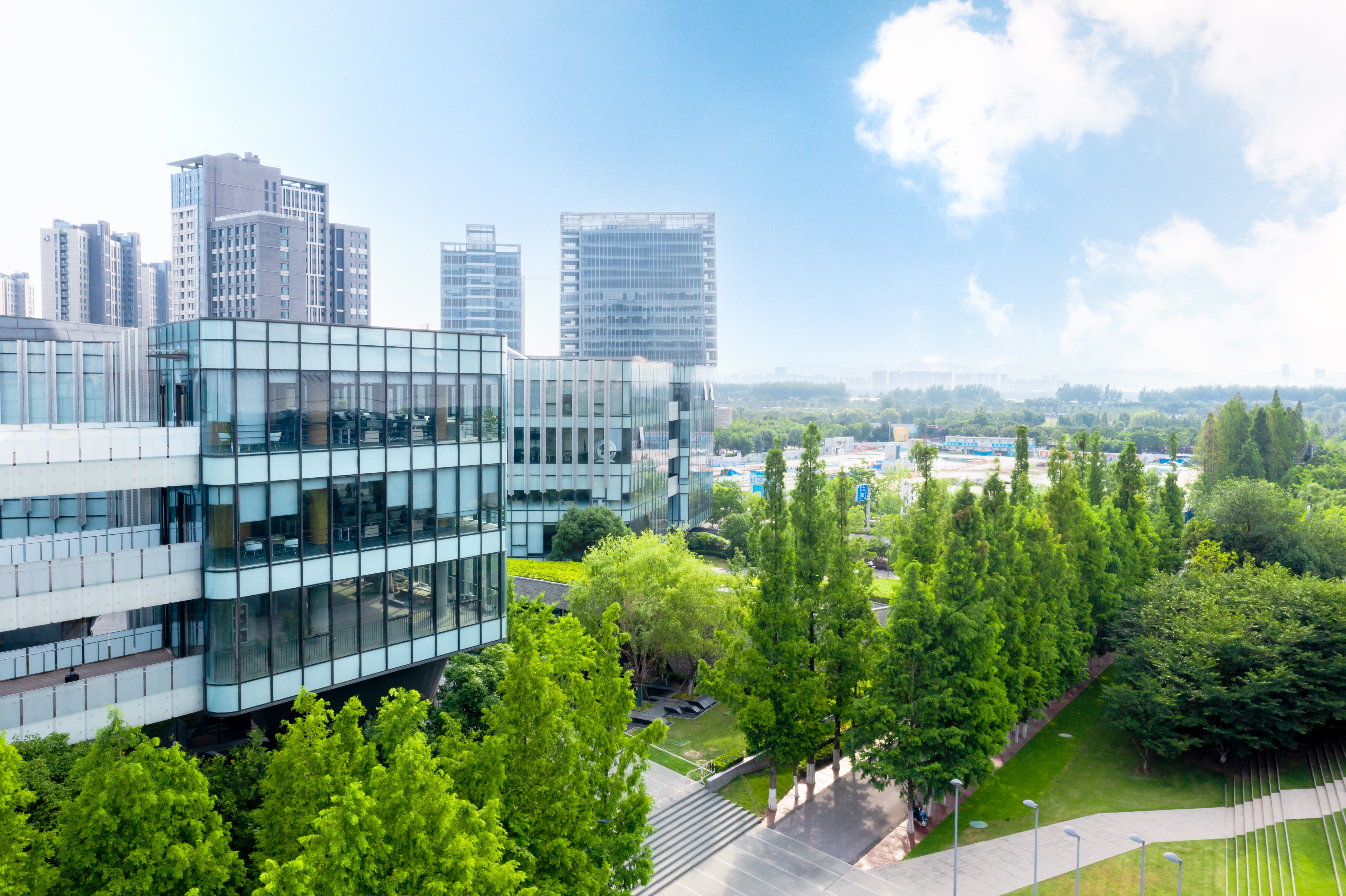 Featured image: Trees by road against buildings in city-ffeaf8f50f15337d47eb