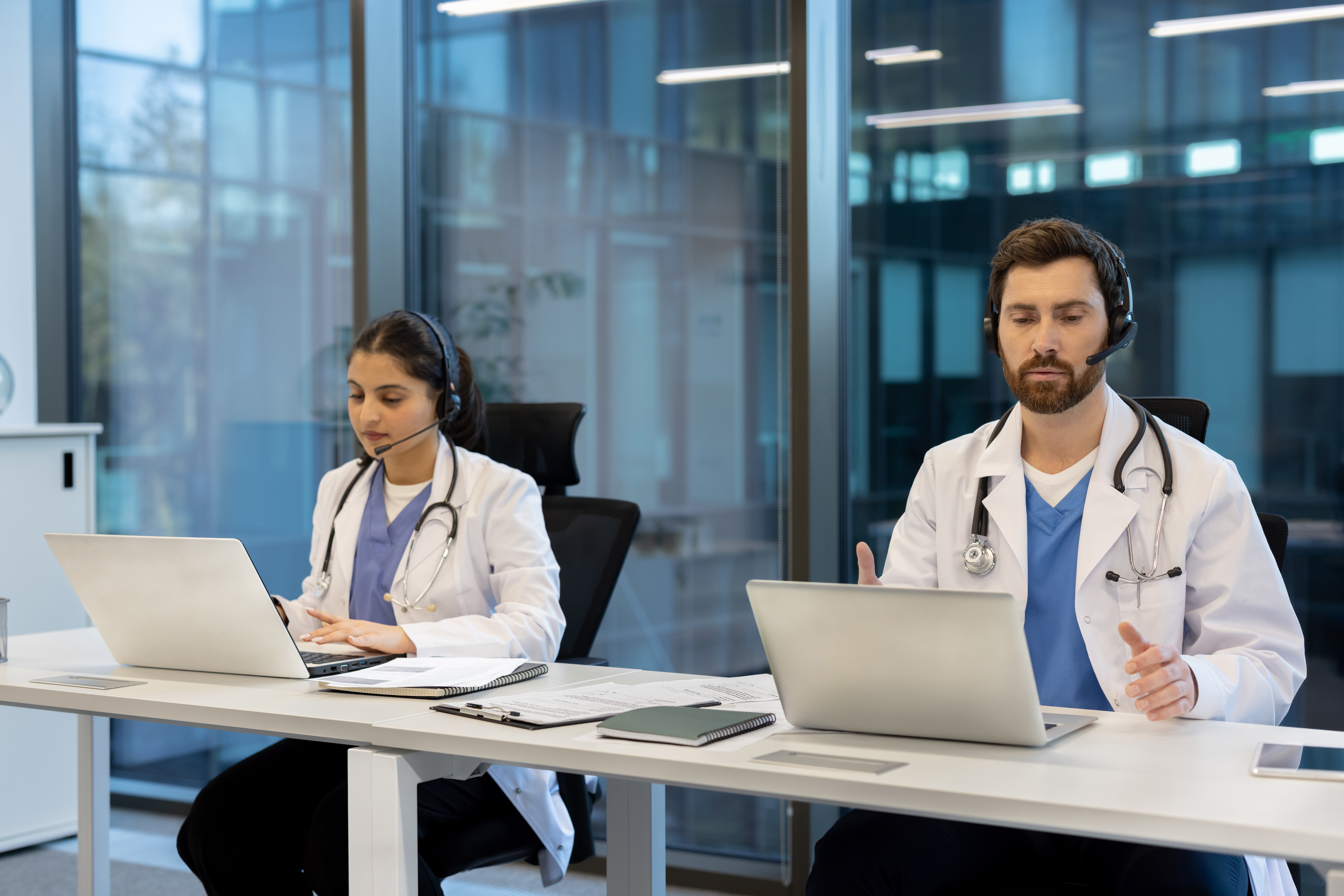 two doctors are providing telehealth services via 868441817c004fd5e55f