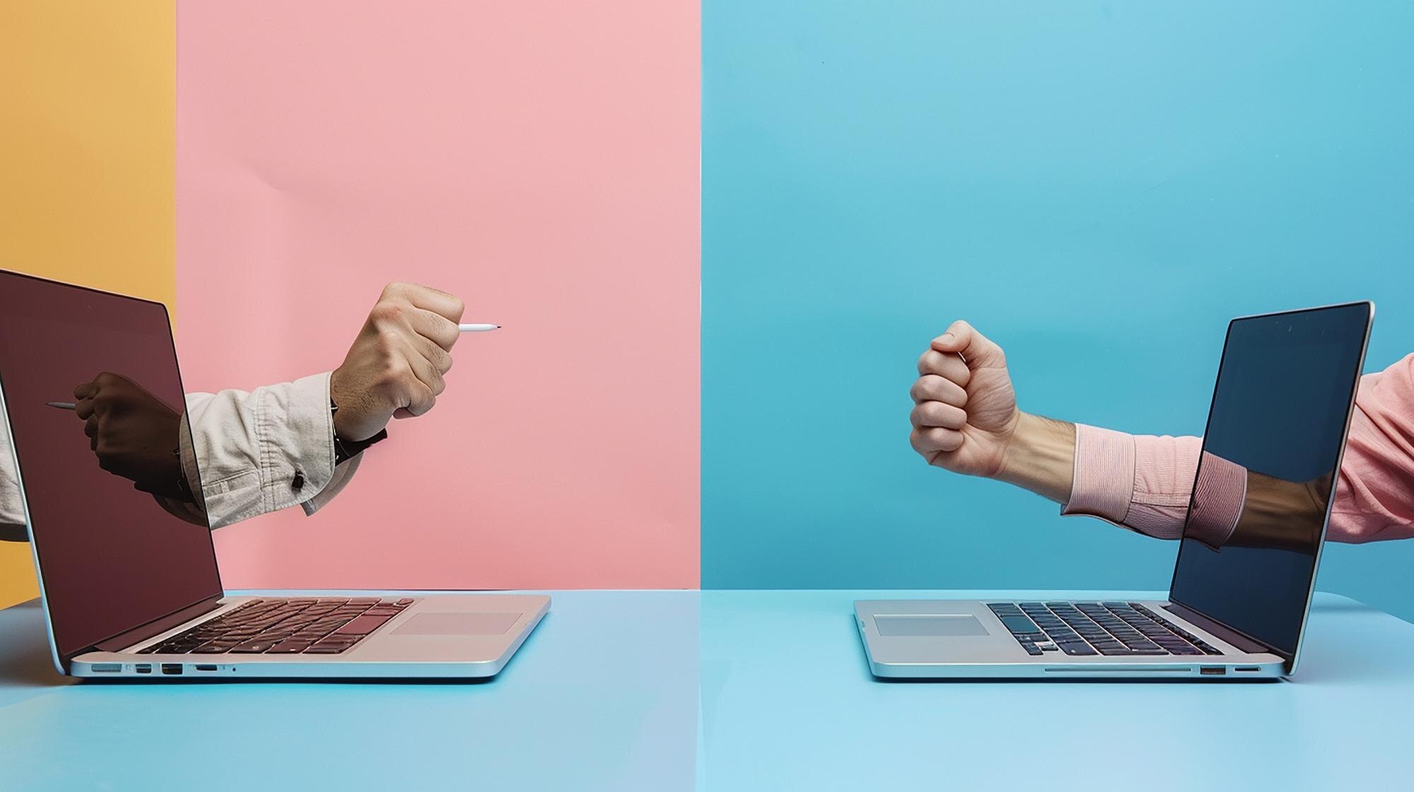 two men are sitting at a desk with two laptops and 33f59d22994dfd0f1155