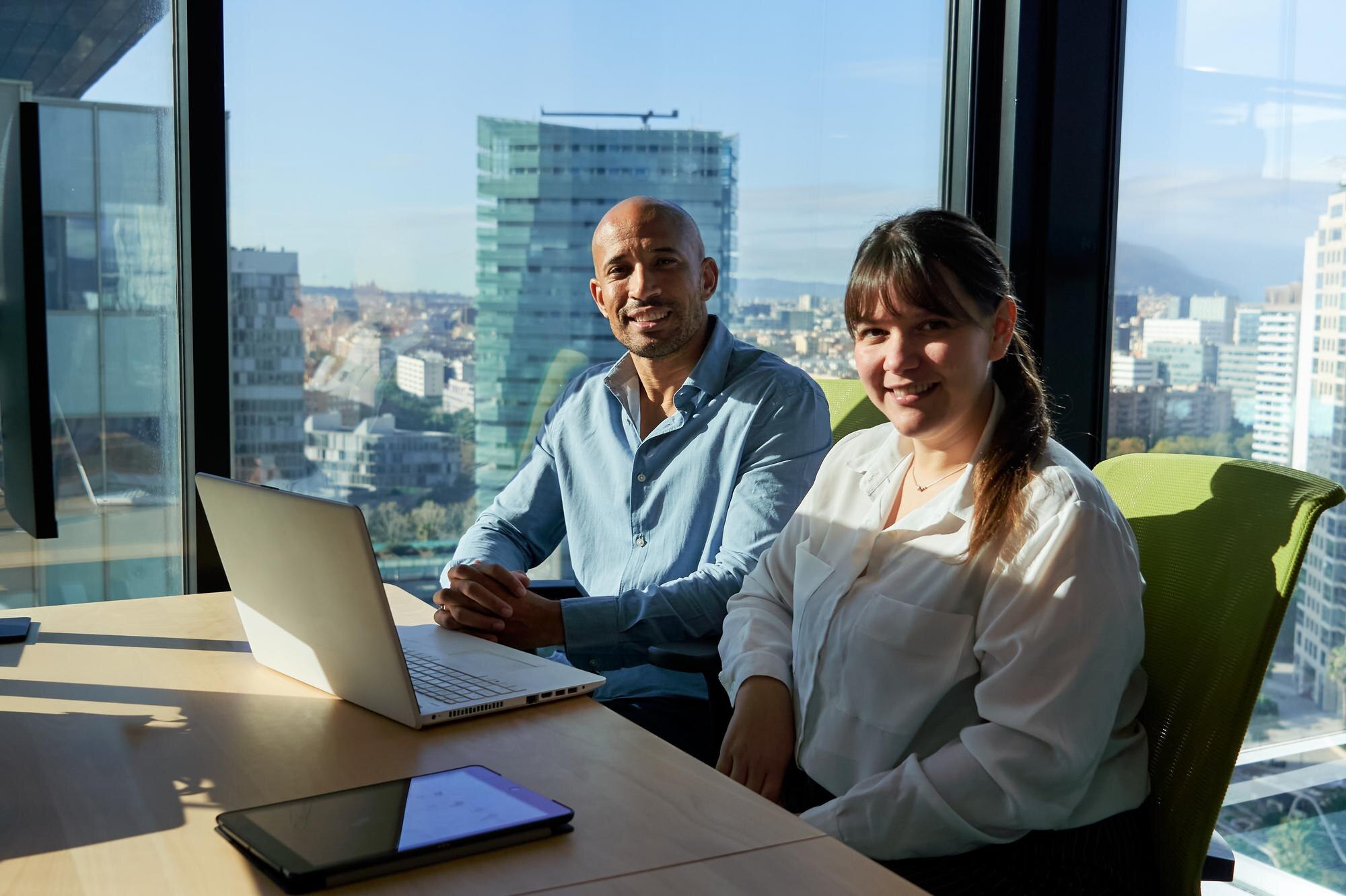 Two Multiracial Business Colleagues Sitting In The 84605E510B3F61D47335