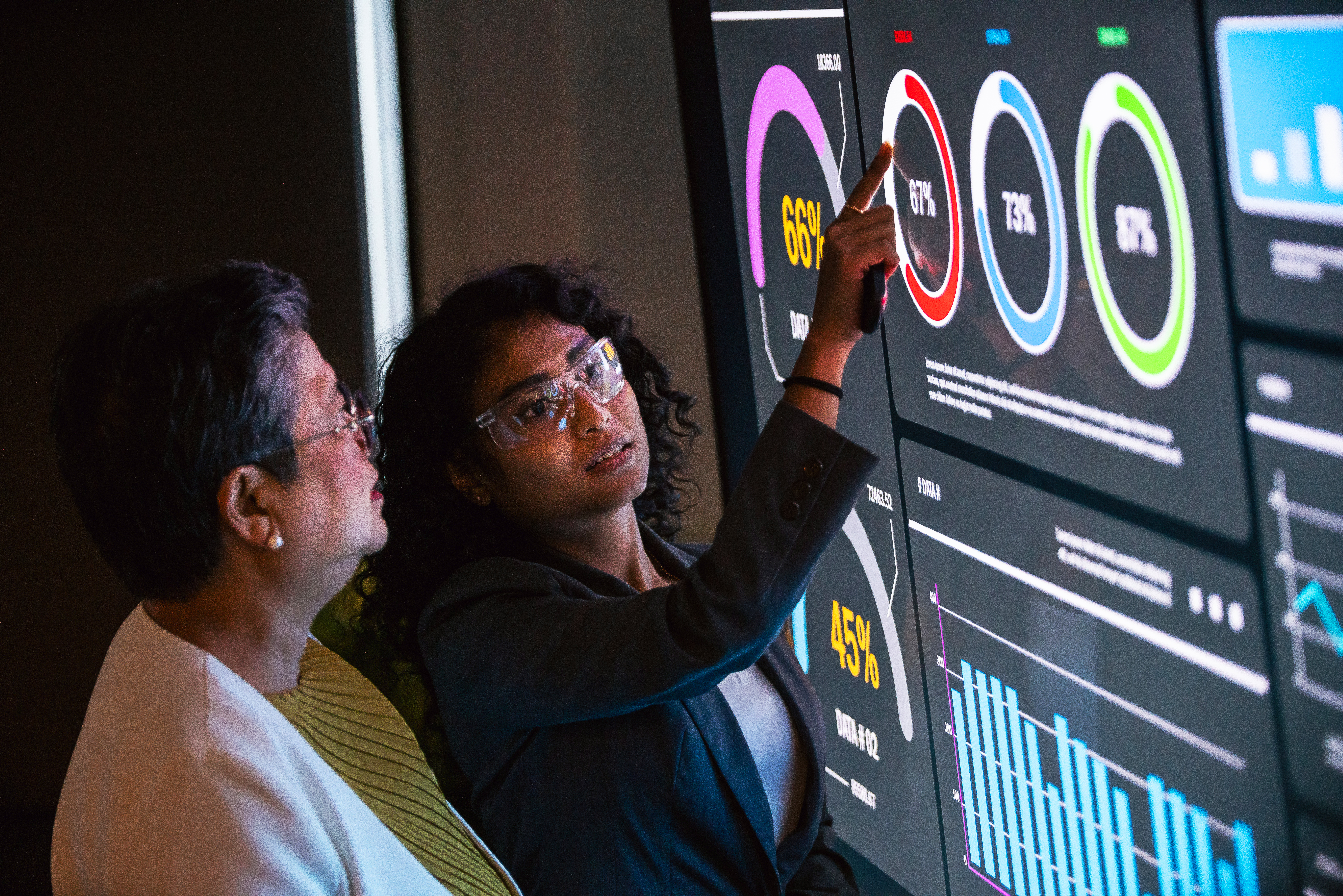 two professionals discuss strategy in modern offic 03c82242cb56a8e0ede1
