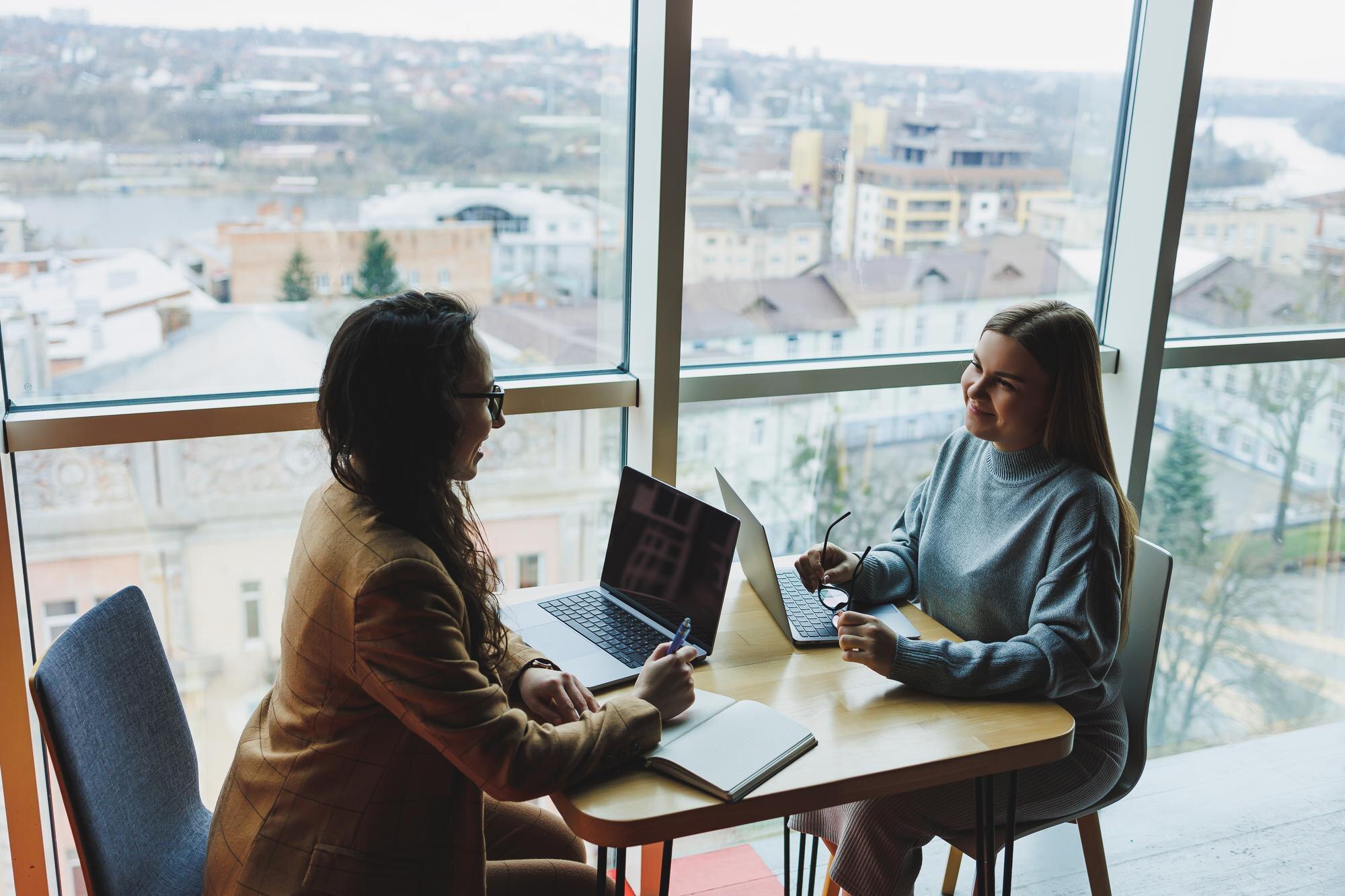 Navigating The Path: What To Expect When Applying For A Bridging Visa In Australia 1 Two Young Female Colleagues Sitting With Laptops N 47499Eb462Ff43345717