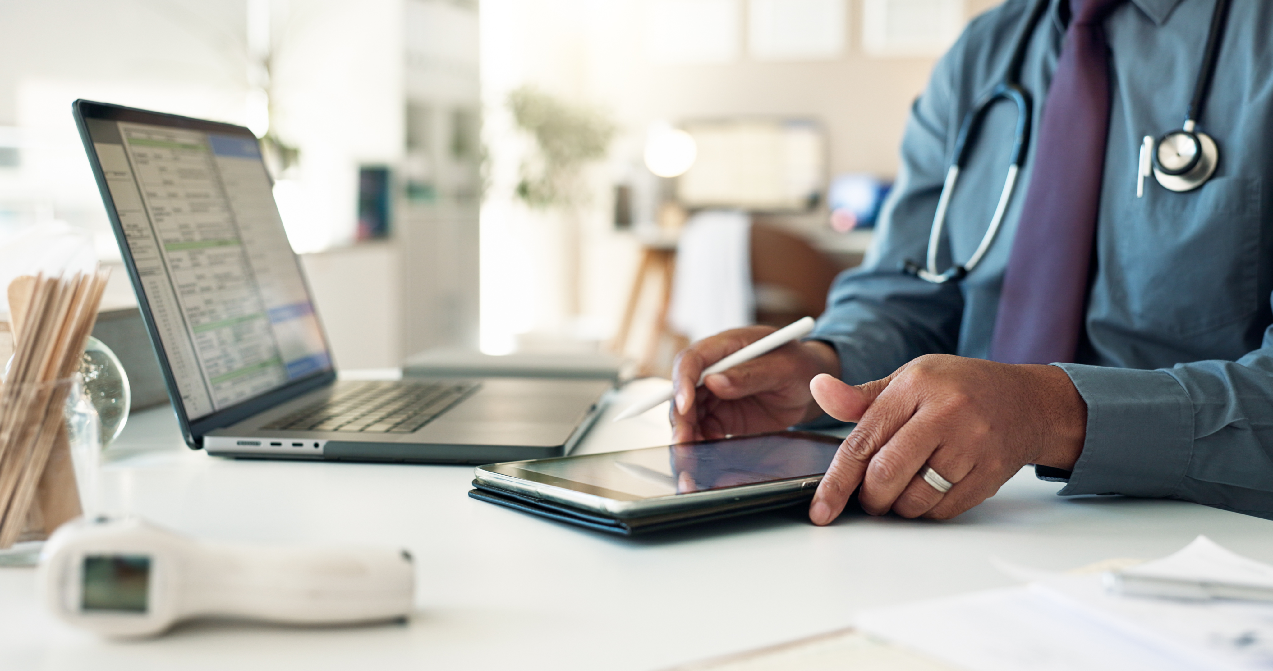 Balancing Professionalism and Approachability in Brand Messaging for Health and Wellness Professionals 3 - MedWell Digital Marketing Agency typing doctor and hands with tablet planning and ee27afba2f929ef3950b - MedWell Digital Marketing Agency