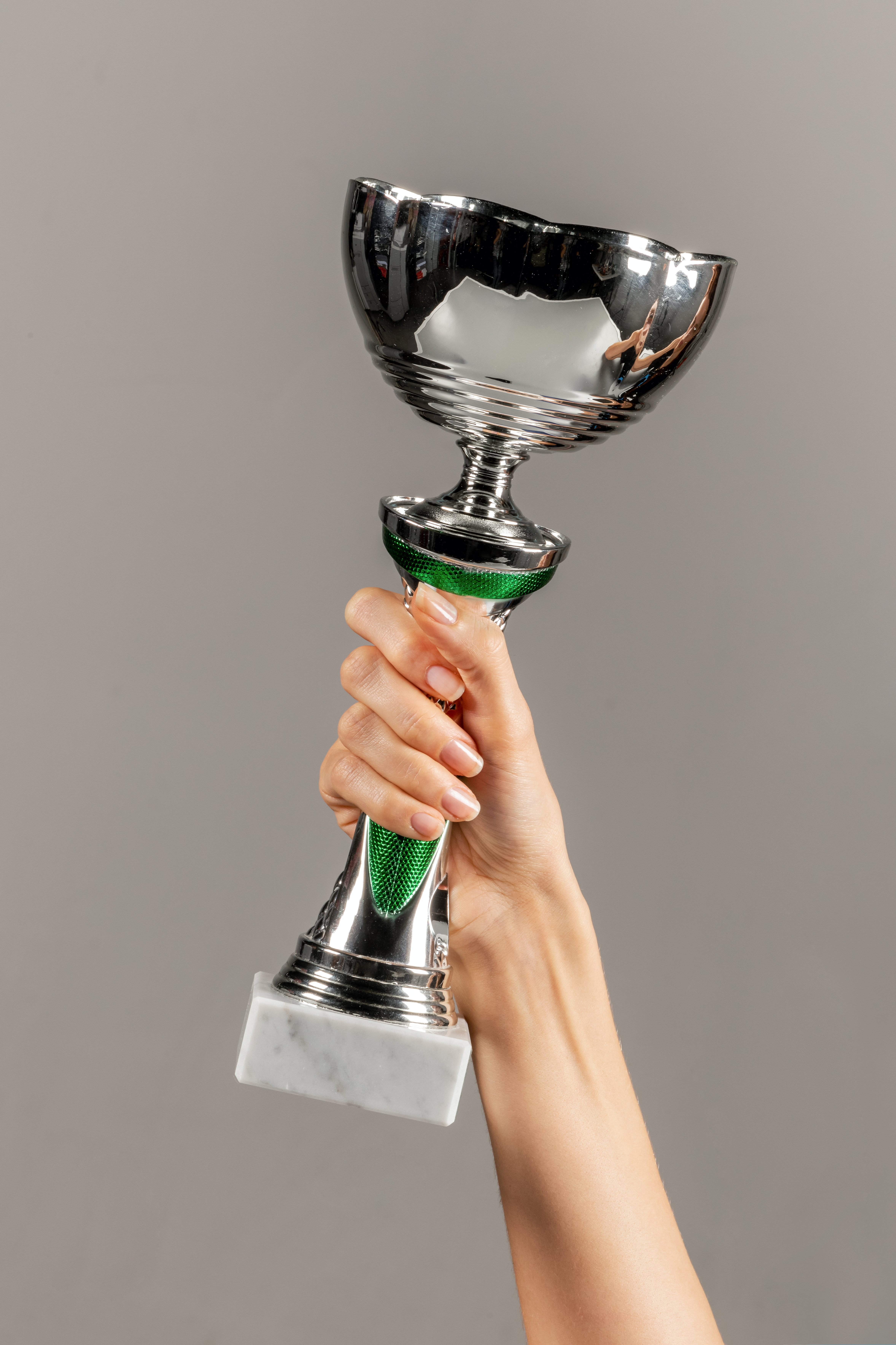 Why Australian Businesses Prefer Award‑Winning Plastic Suppliers 1 unrecognizable woman holding trophy in hand agains c2696585c21707c00455