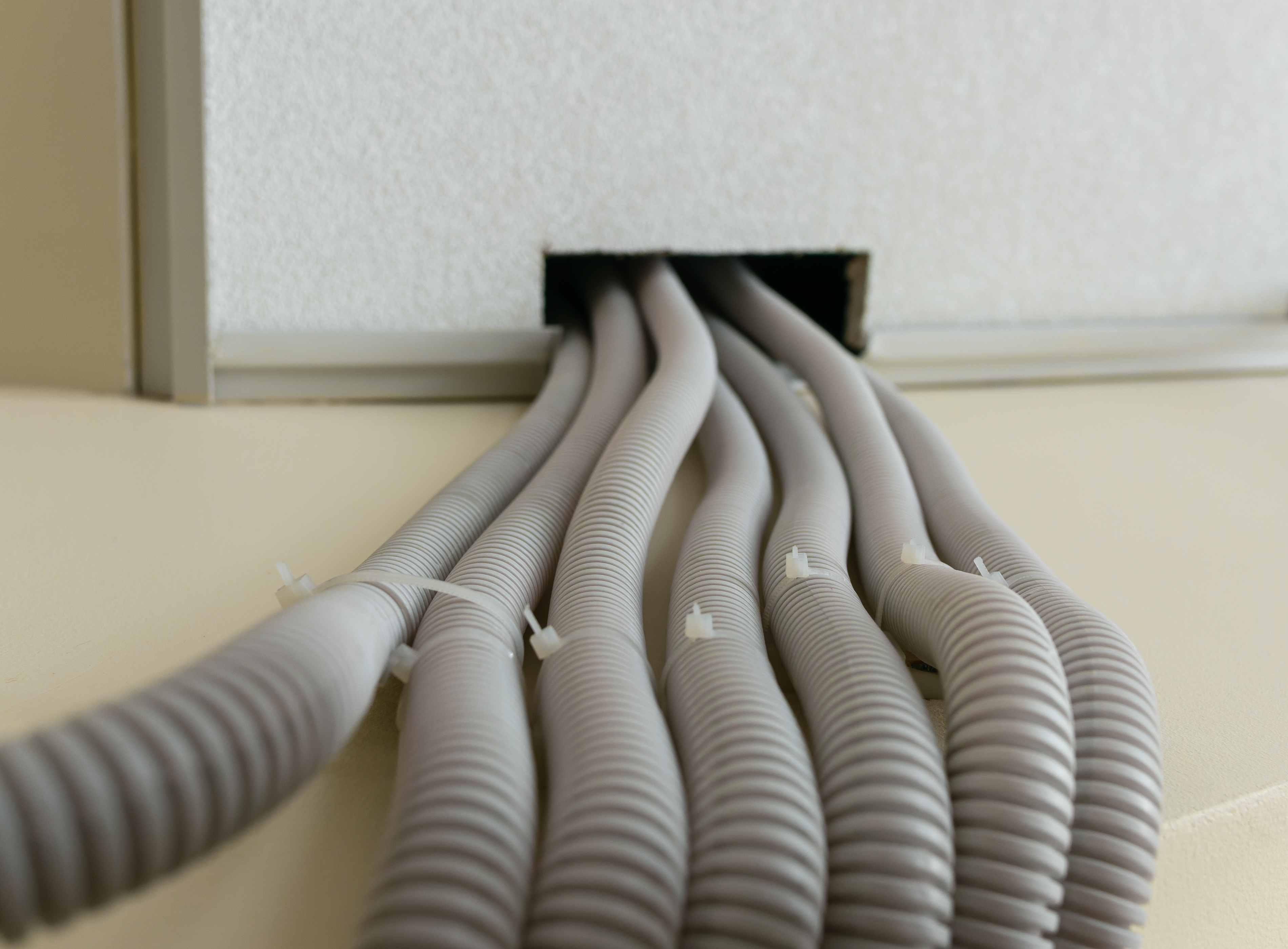 upward view of wires in corrugated plastic protect 07f3baab6da9f35c6a8f