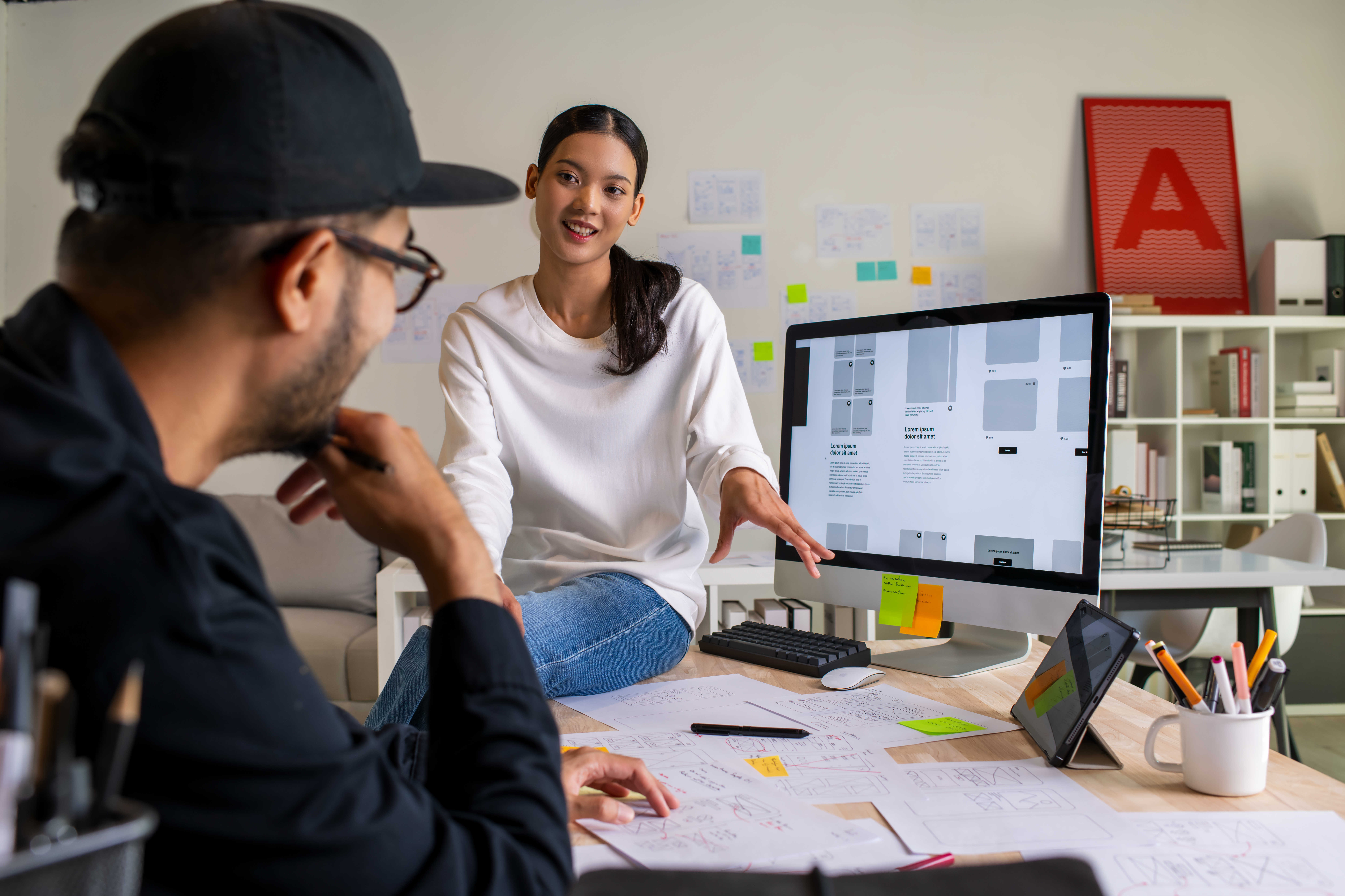 Mastering UX and UI: Elevate Your User Journey with Defyn Digital 11 ux ui designers discussing and brainstorming on wi e6cd82be3c728faef73a