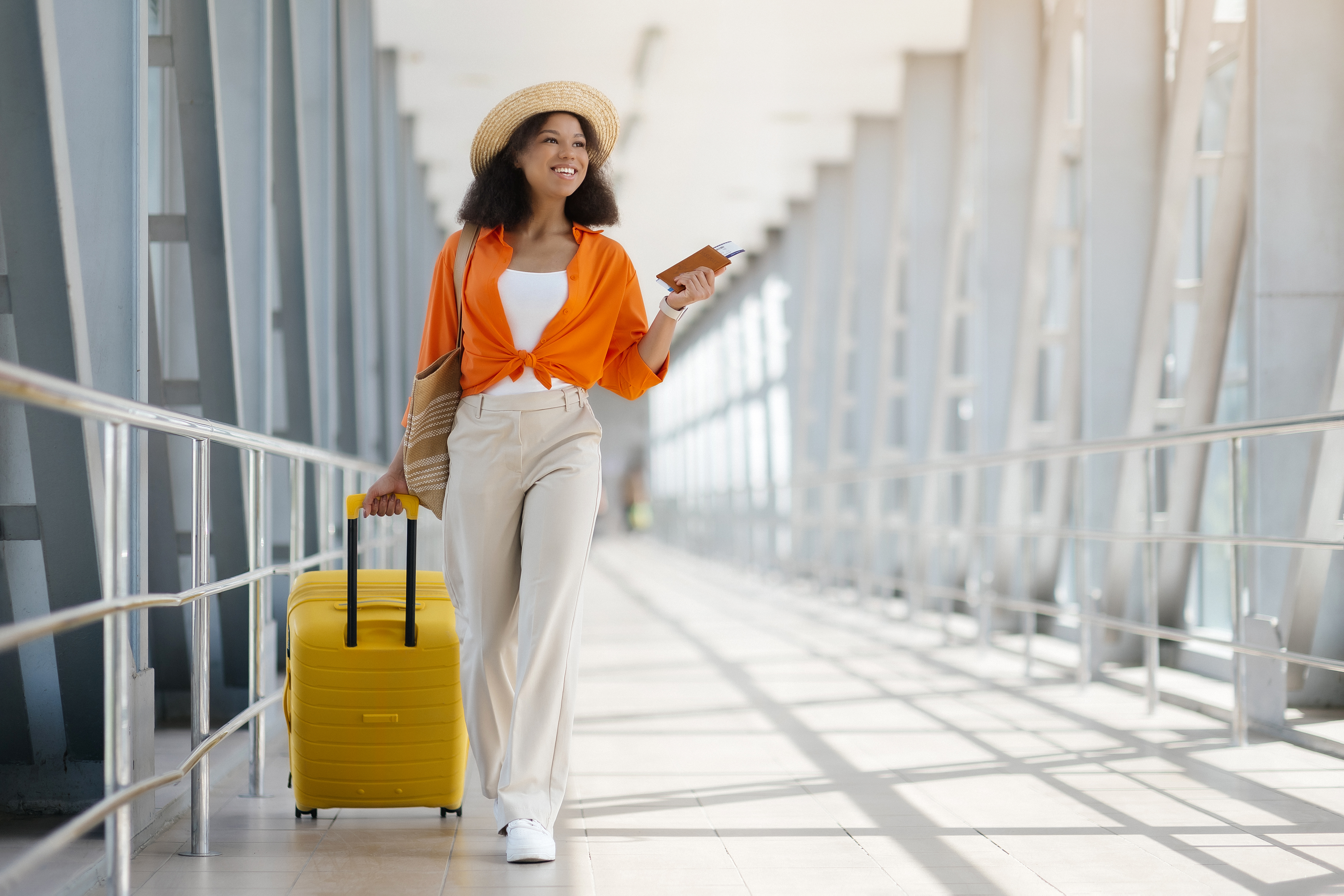vacation travel black woman wearing straw hat wal 0513153c4f5d640ce62e