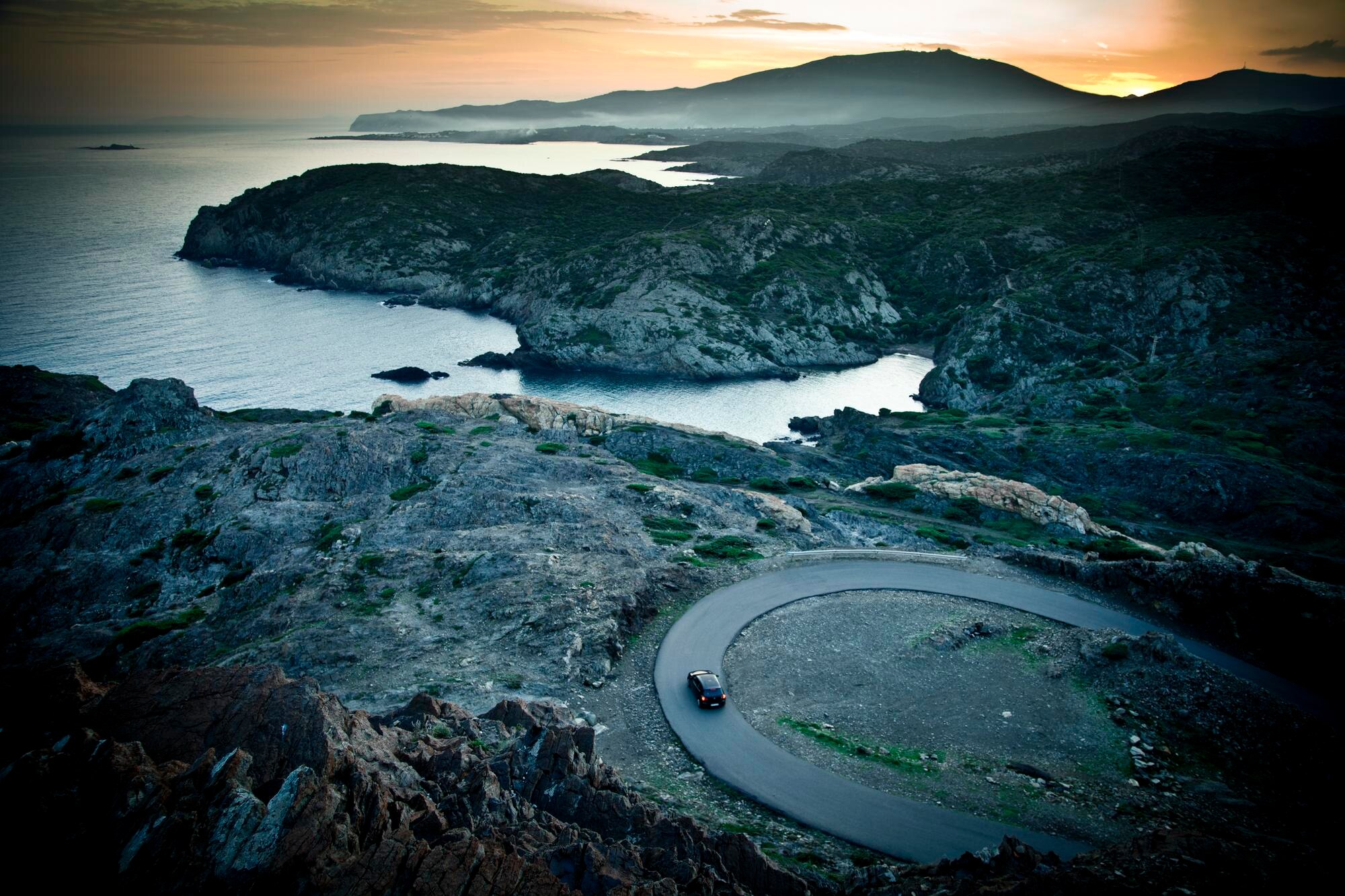 view of the curve road by sea during sunset bb89559eab9c0e8ea99f BTOURS