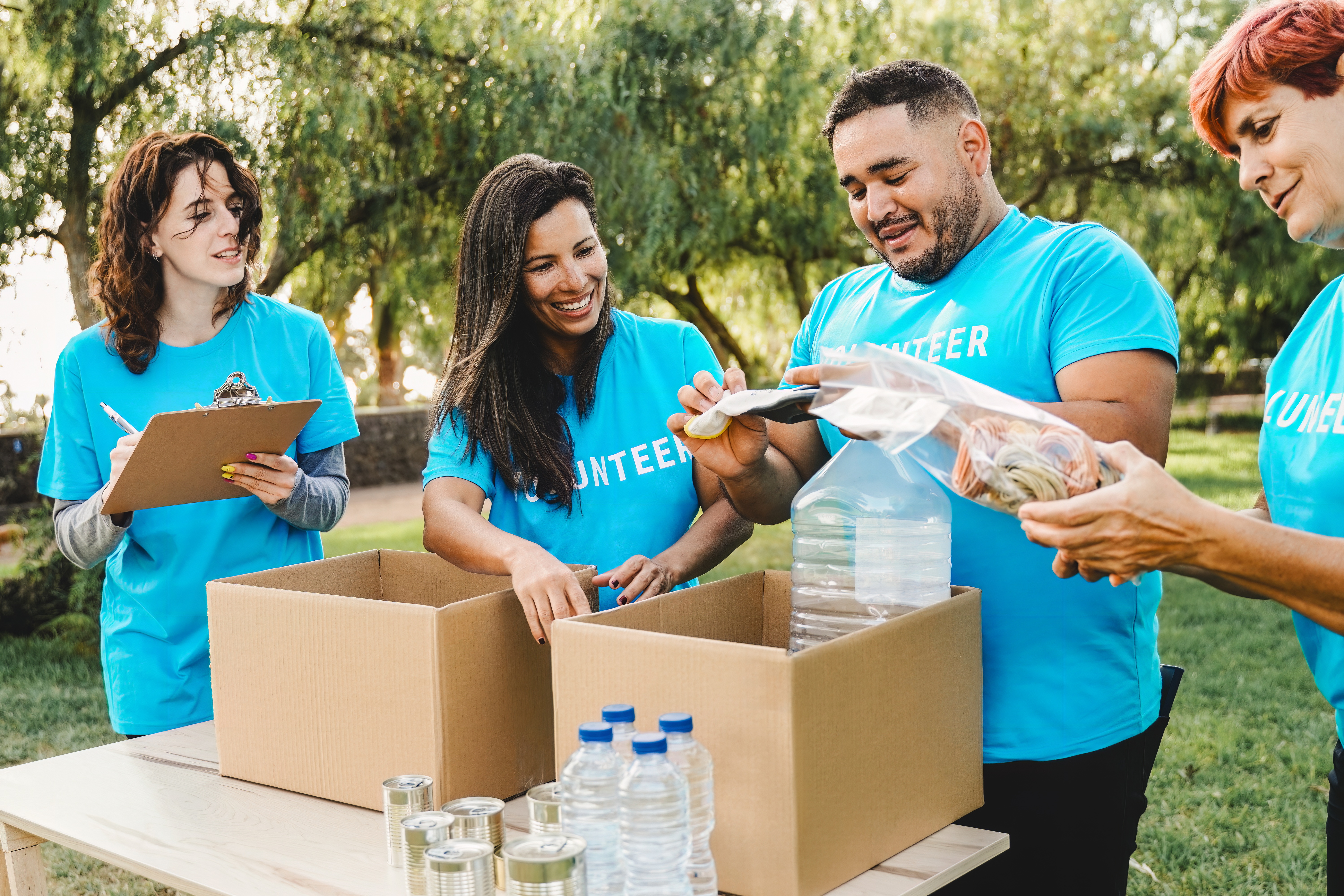 volunteer people collecting goods and food for com 1ca9d1d9d843799af6c8