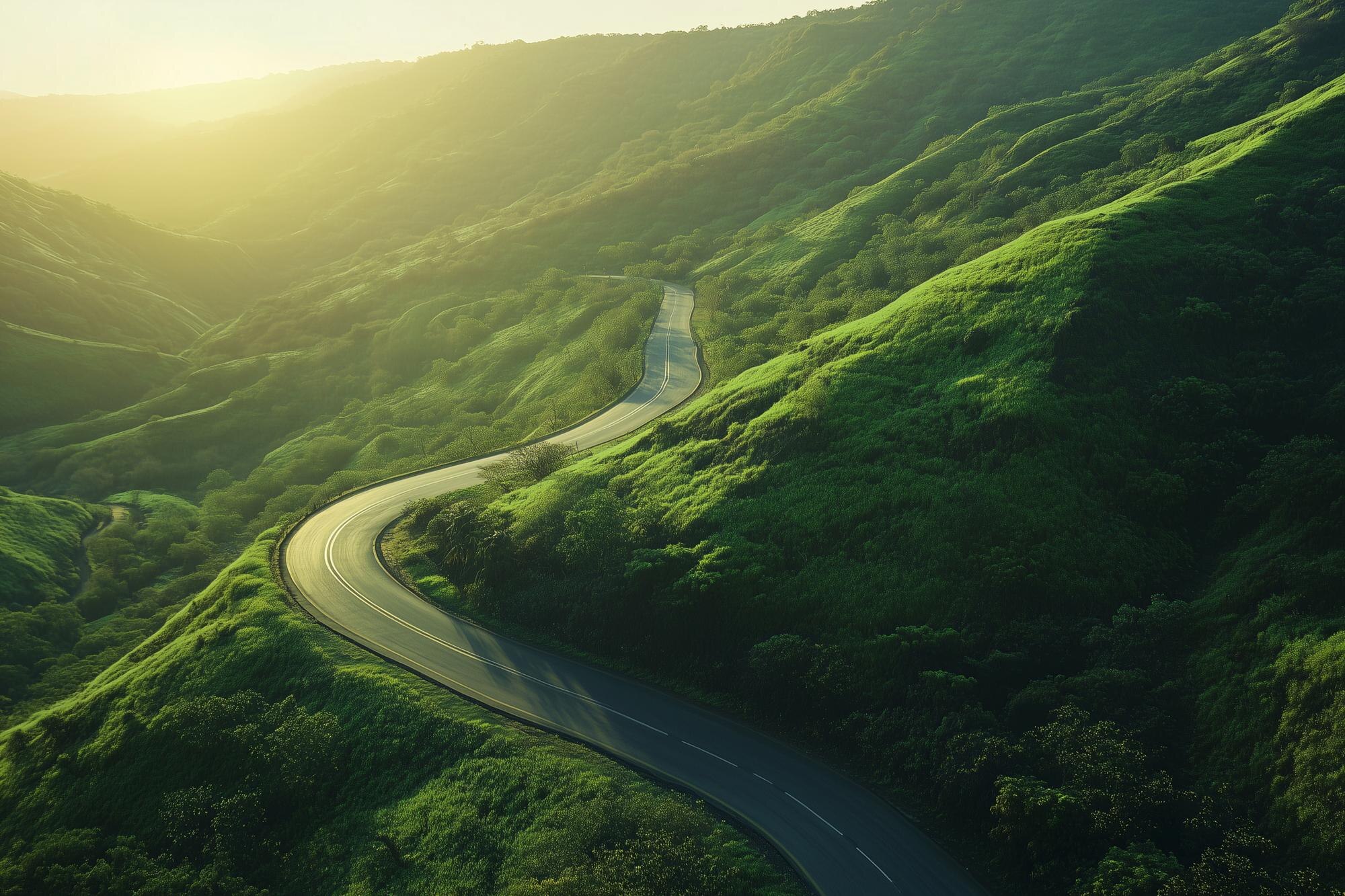 winding road with a beautiful sunset in the backgr 52813d7a7ac95f9c4ec2 BTOURS