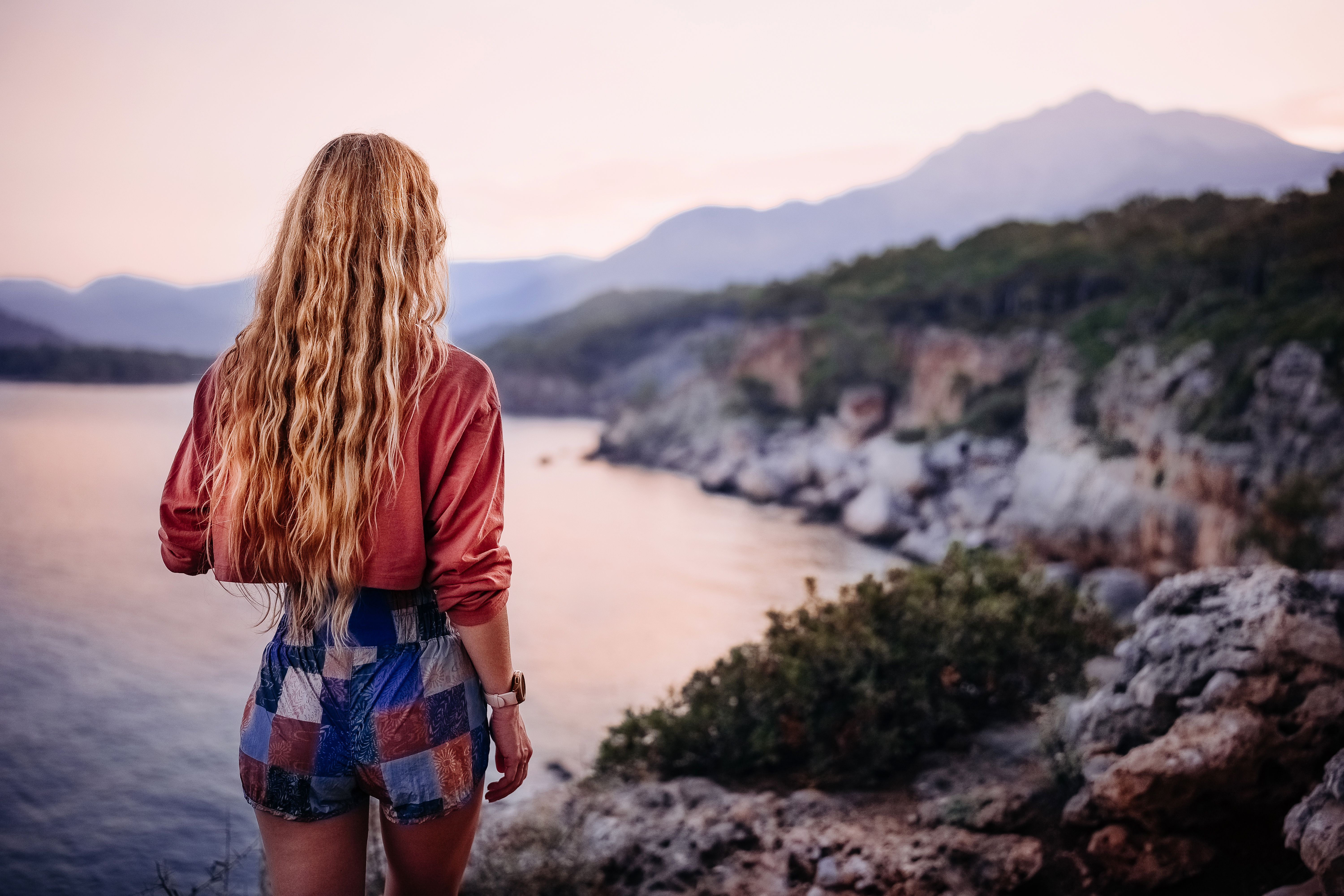 woman gazes at sunset over a coastal landscape nea 755fa8d1ae8de6714783 BTOURS