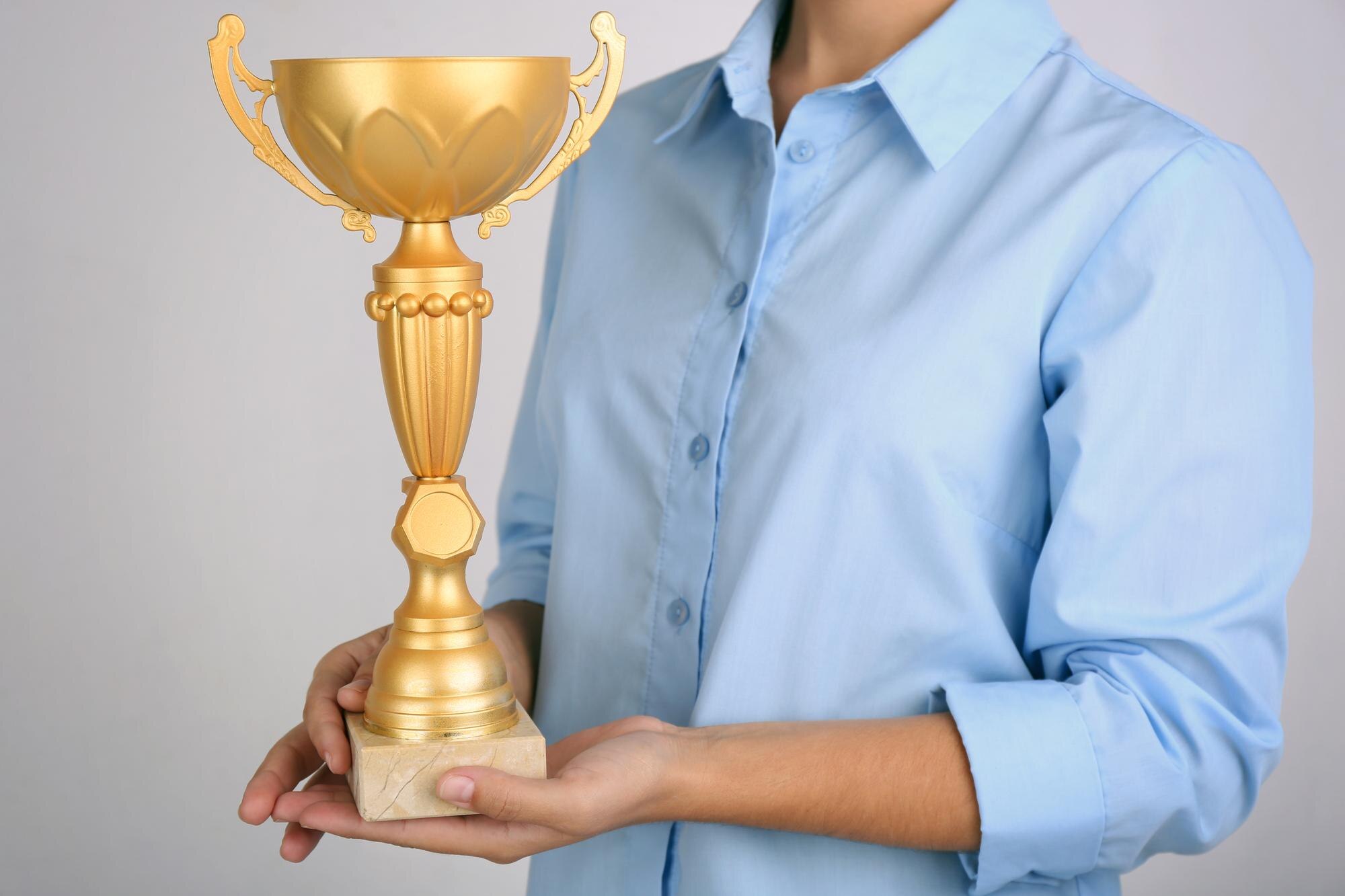 From Awards to Assurance: How Award‑Winning Service Builds Confidence in Plastic Fabrication 2 woman holding trophy cup on color background 63173fd117d0bd701e1b
