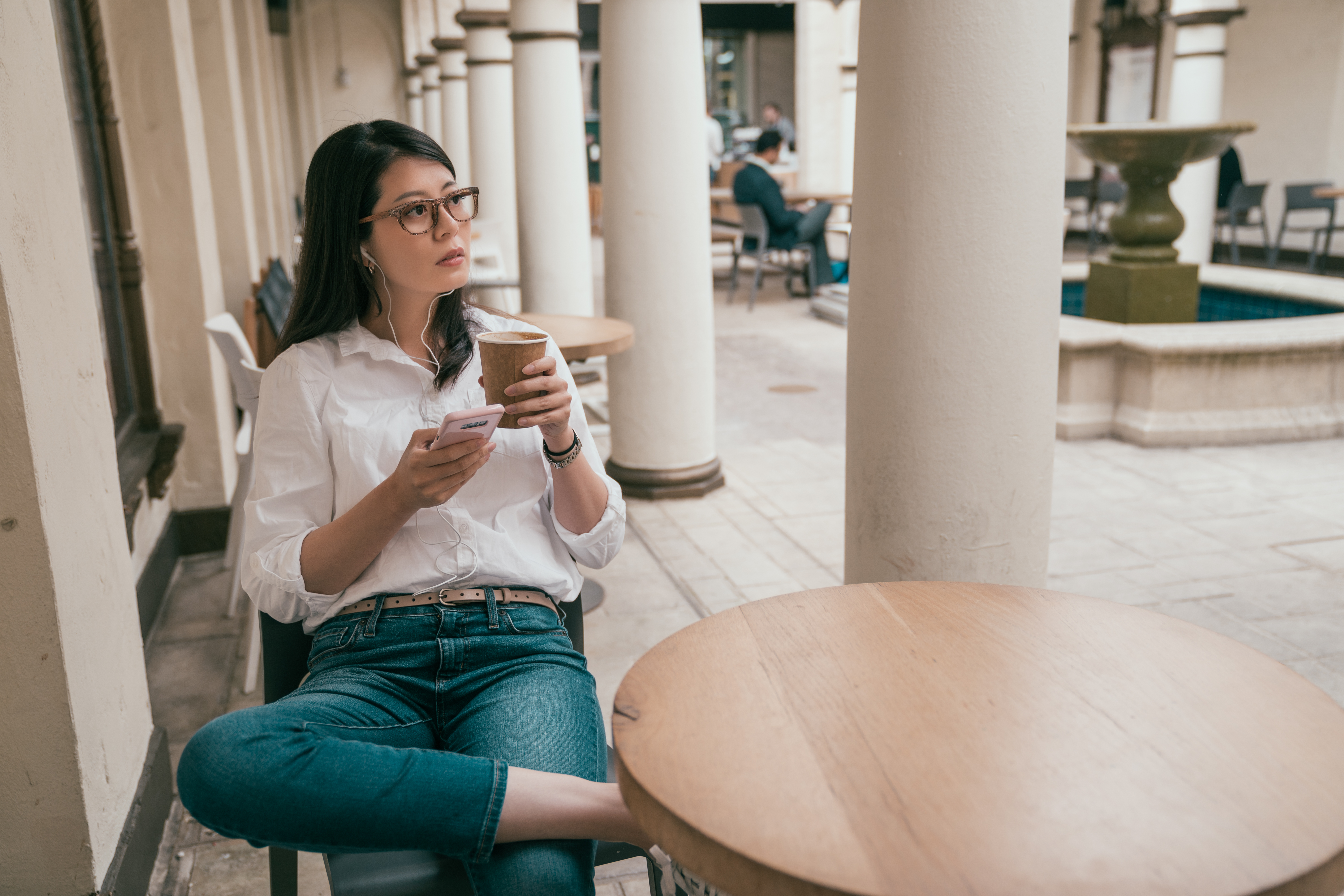 Girl on phone at coffee shop