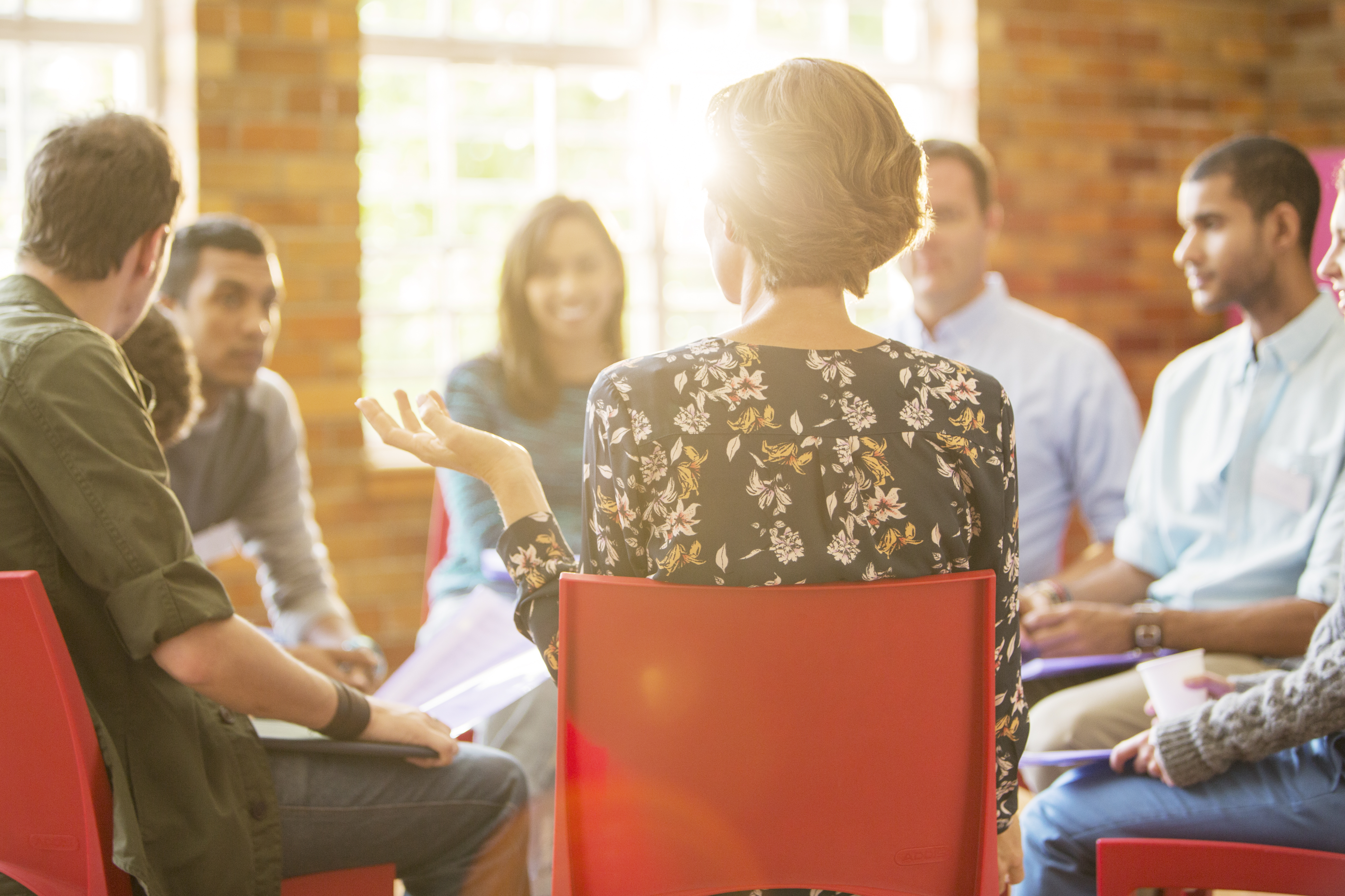 woman speaking in group therapy session e2944a881b1bb5755acd