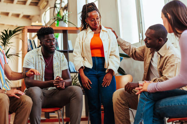 Strength in Numbers: How Community Support Can Conquer Self-Doubt Woman Standing In Group Therapy B3c9fc25909c723eedc7