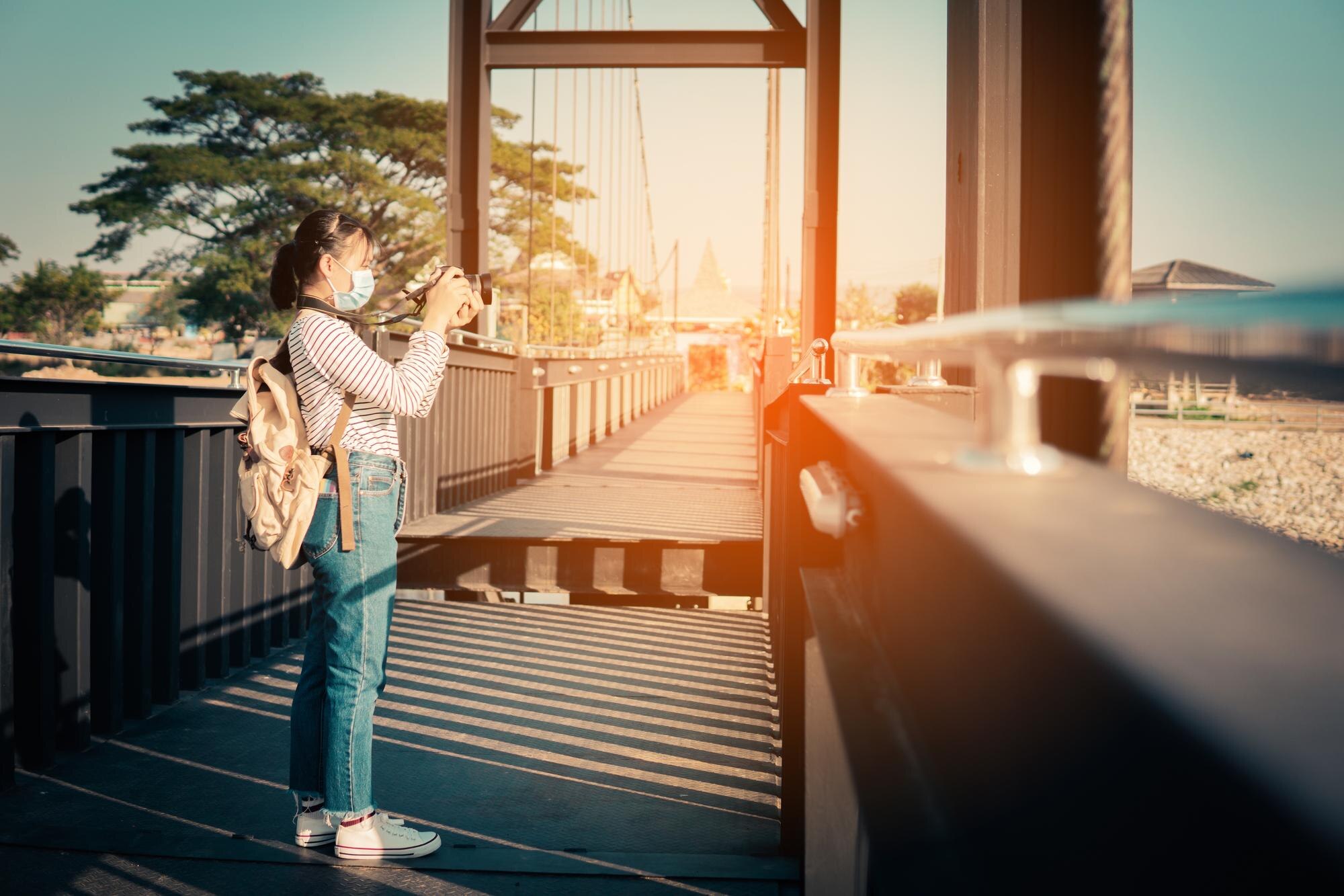 woman standing on mobile phone against sky e90556c4db3e87438ade BTOURS