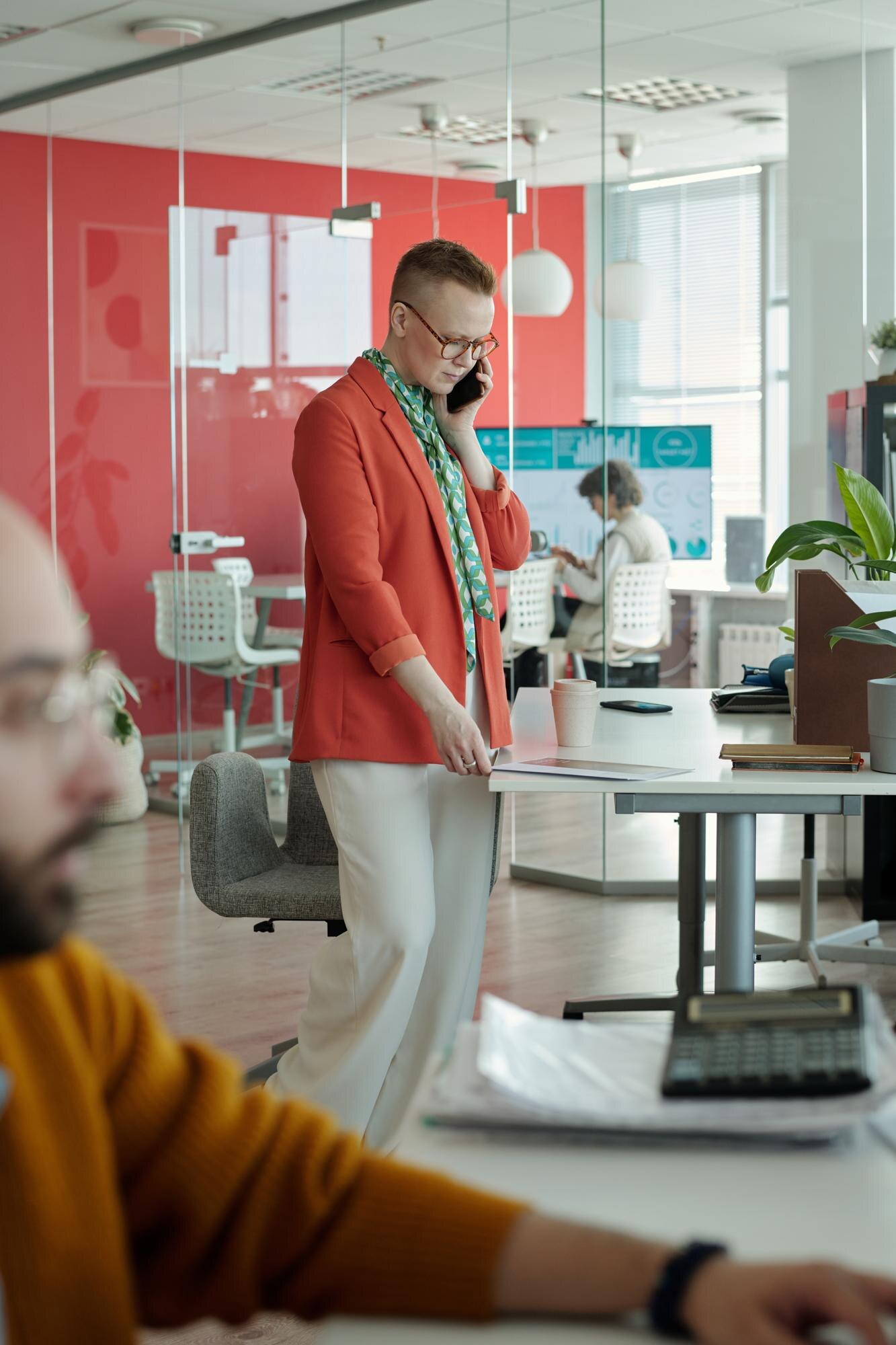 woman talking on smartphone in modern office 294344324d90a5c5e3a5