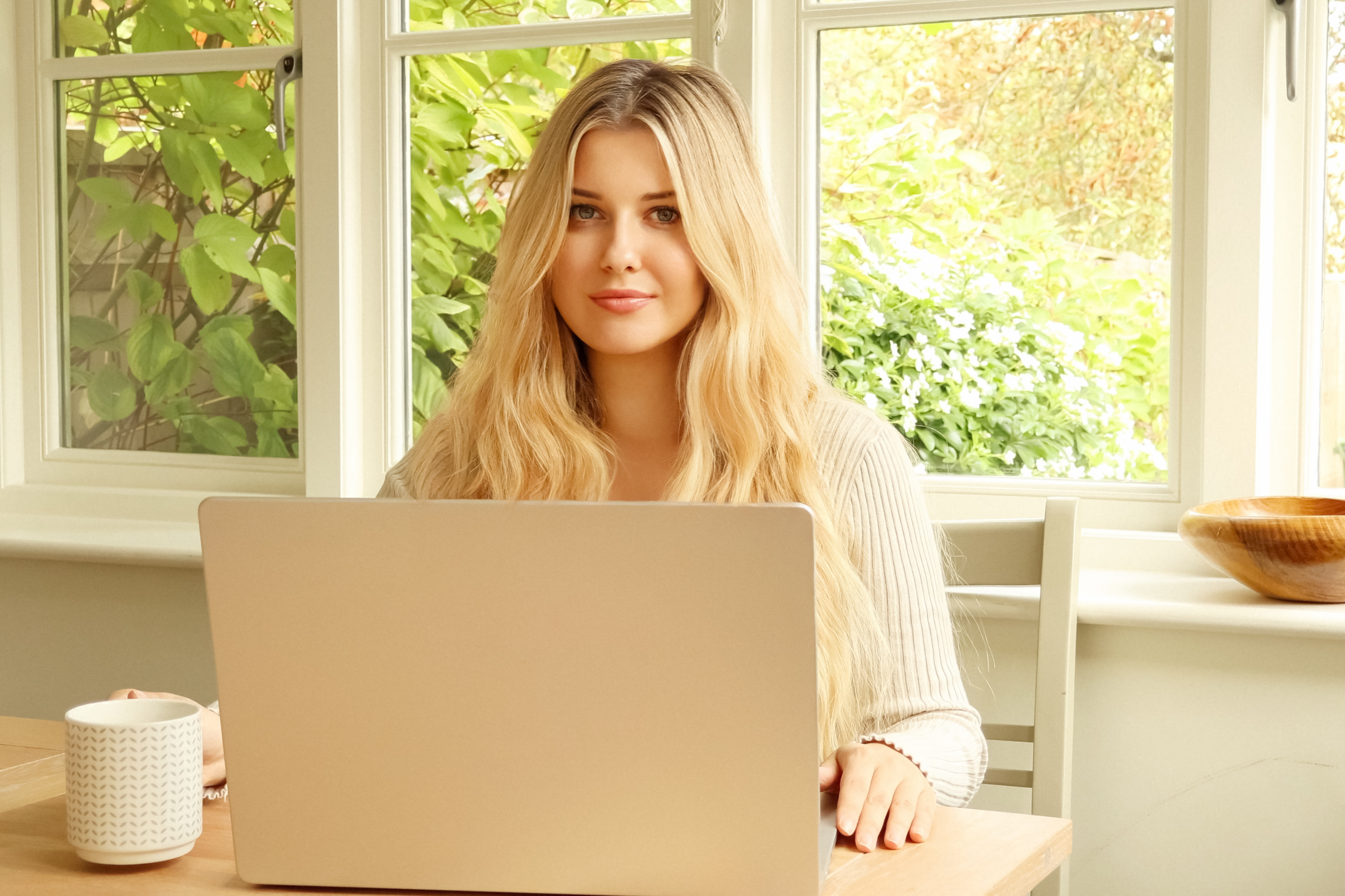 woman using a laptop in a bright home environment 534848bcc175b4dd2479