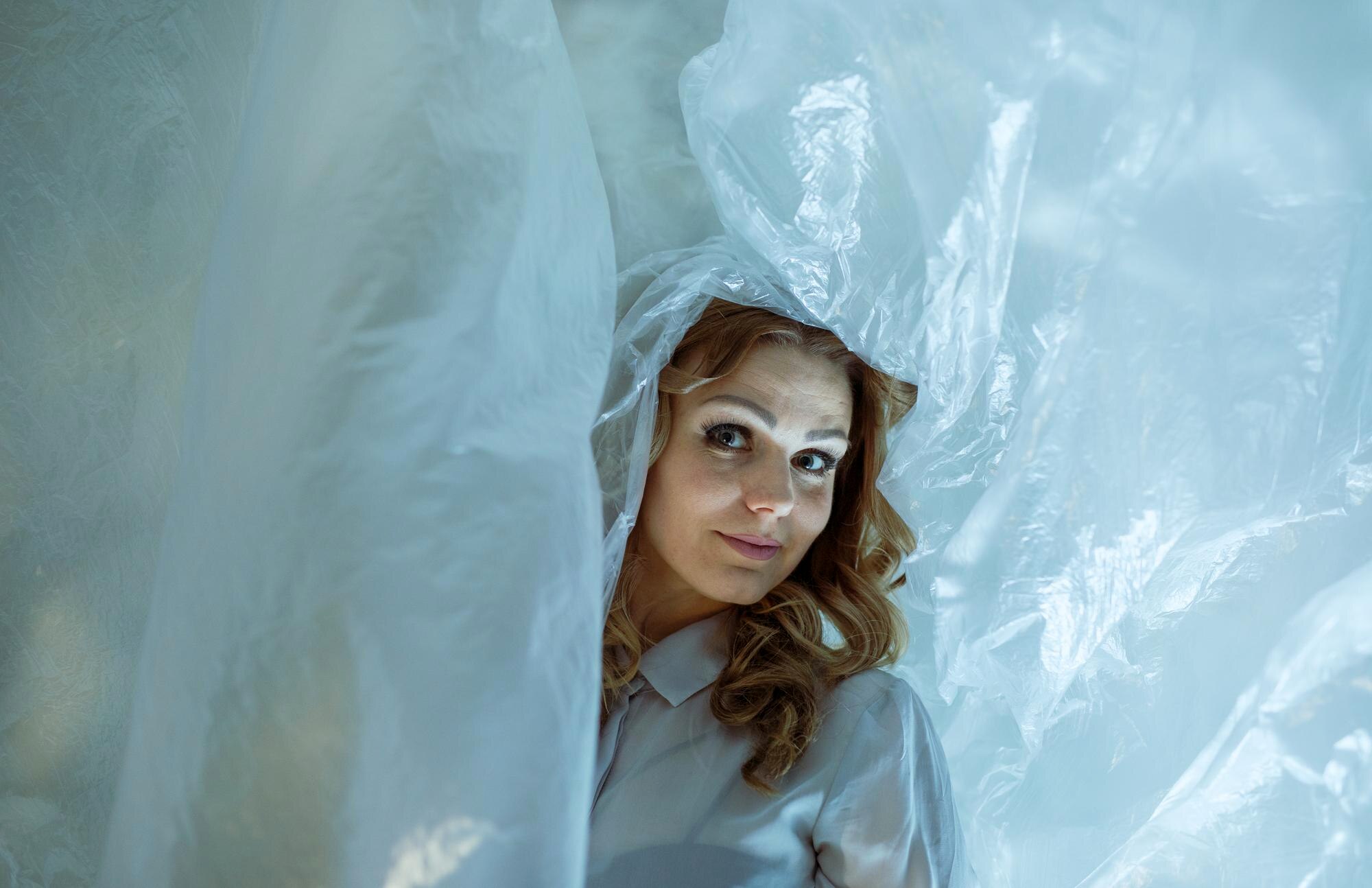 The real cost of cheap plastics: how to spot and avoid hidden expenses 3 woman with plastic against wall 29368ff5d18db69cf9f5