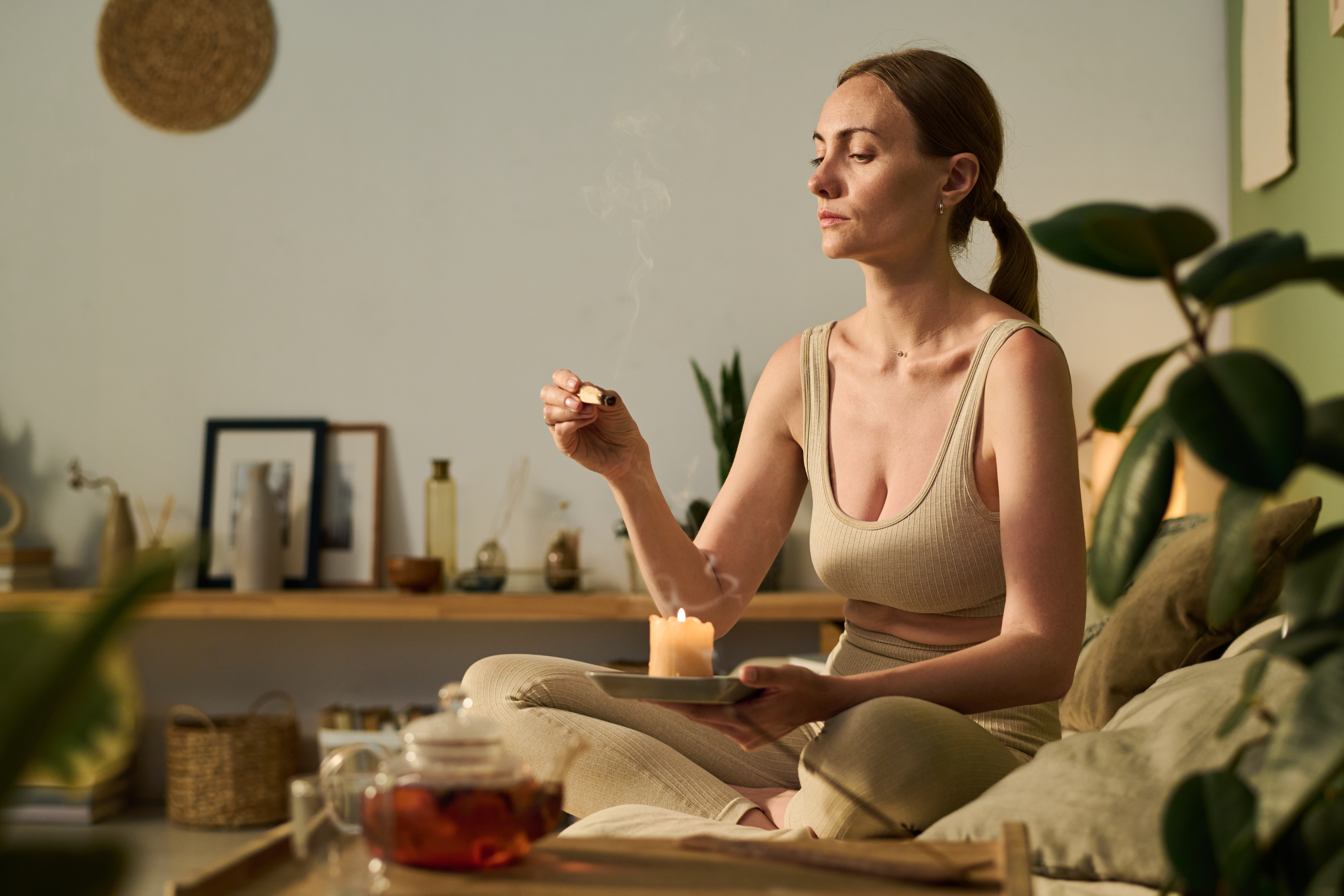 woman with smoking sandalwood stick 08f395ff9879570afa1f