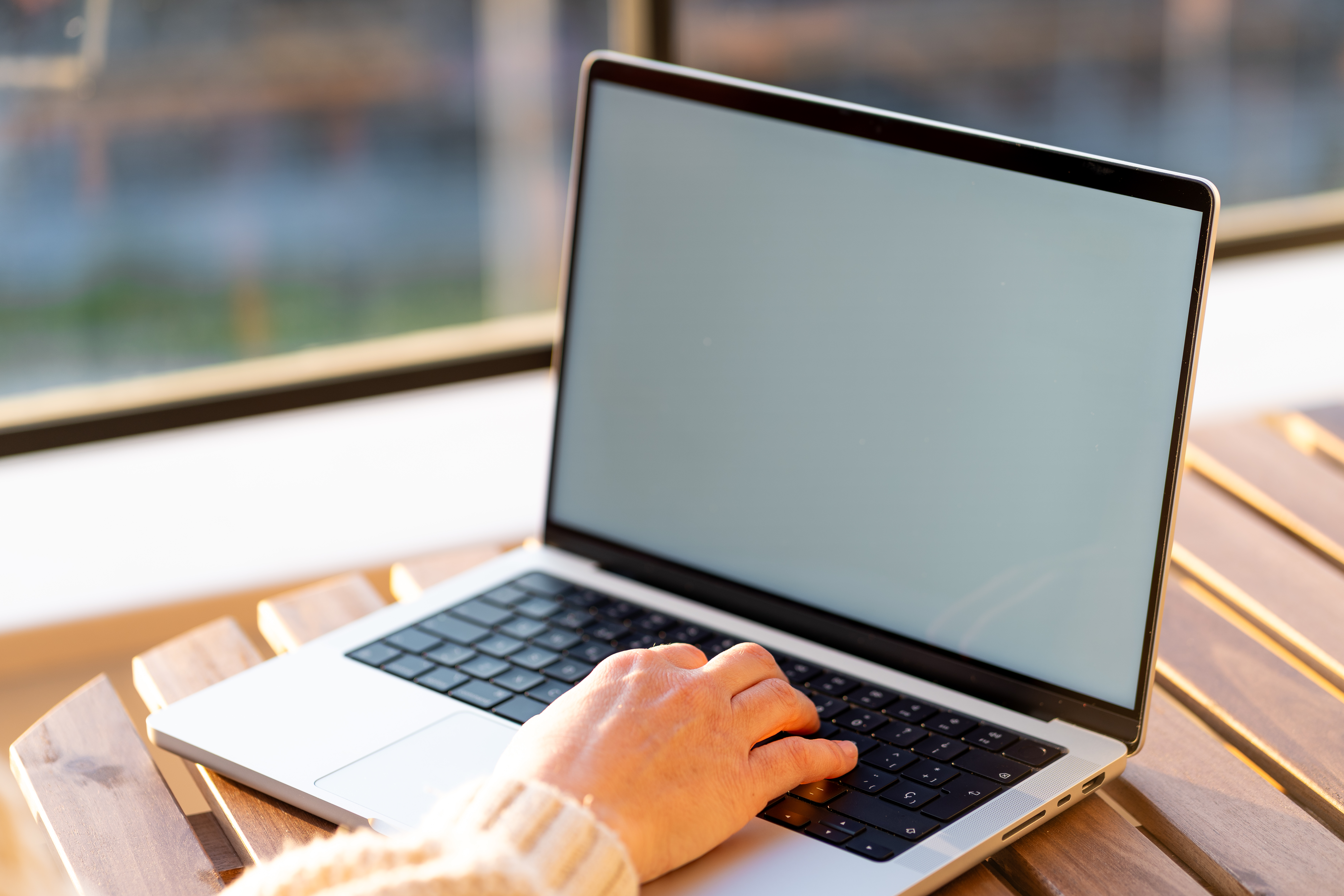 10 simple ways to make your small business website look professional (without breaking the bank) 3 woman working on her computer outdoors under the s 2facbc231587a8498772