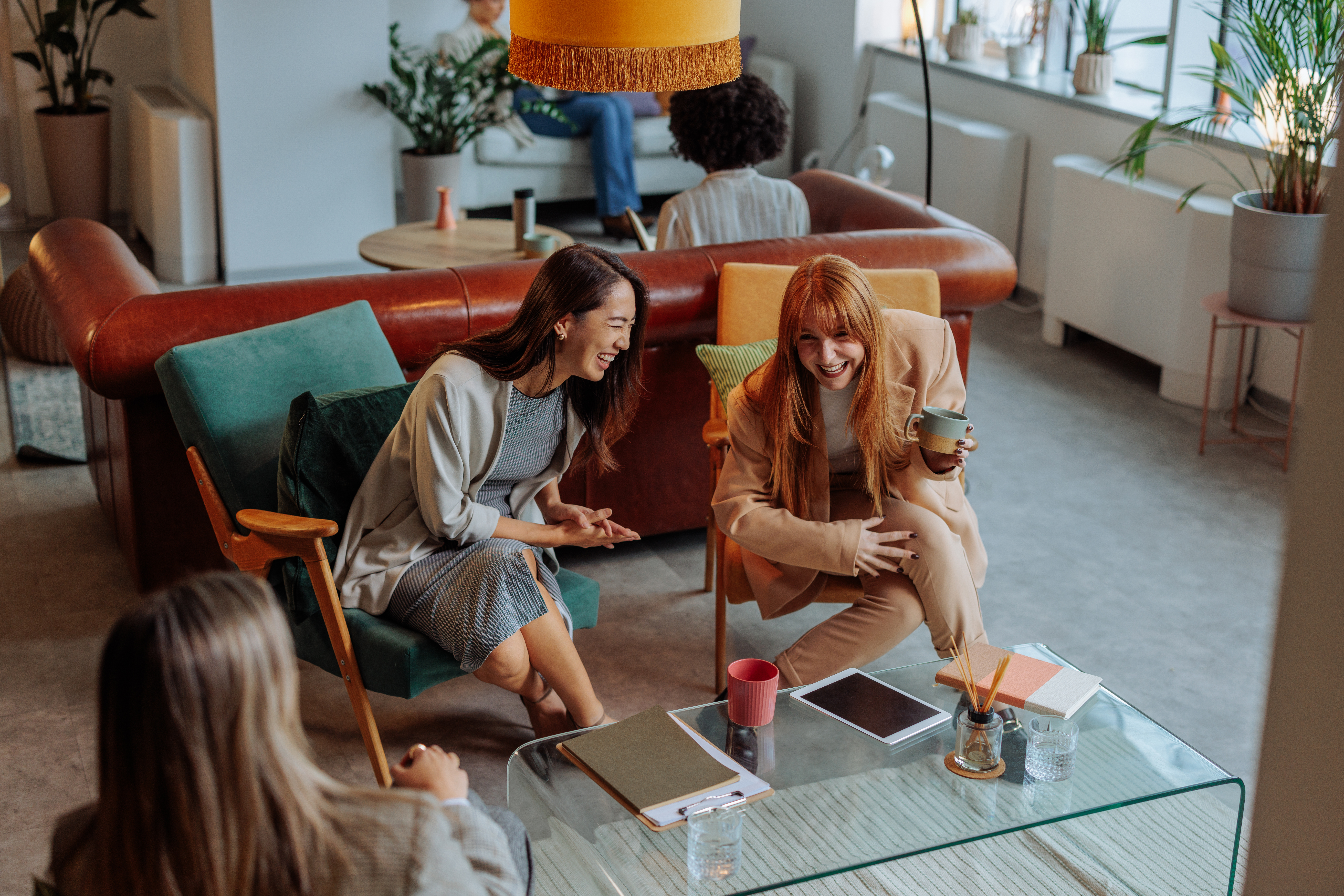 Empowering Your Wanderlust: How Travel Mentorship Fuels Business Growth 2 women colleagues laughing and talking 2421a235b1d5dd61d0cf