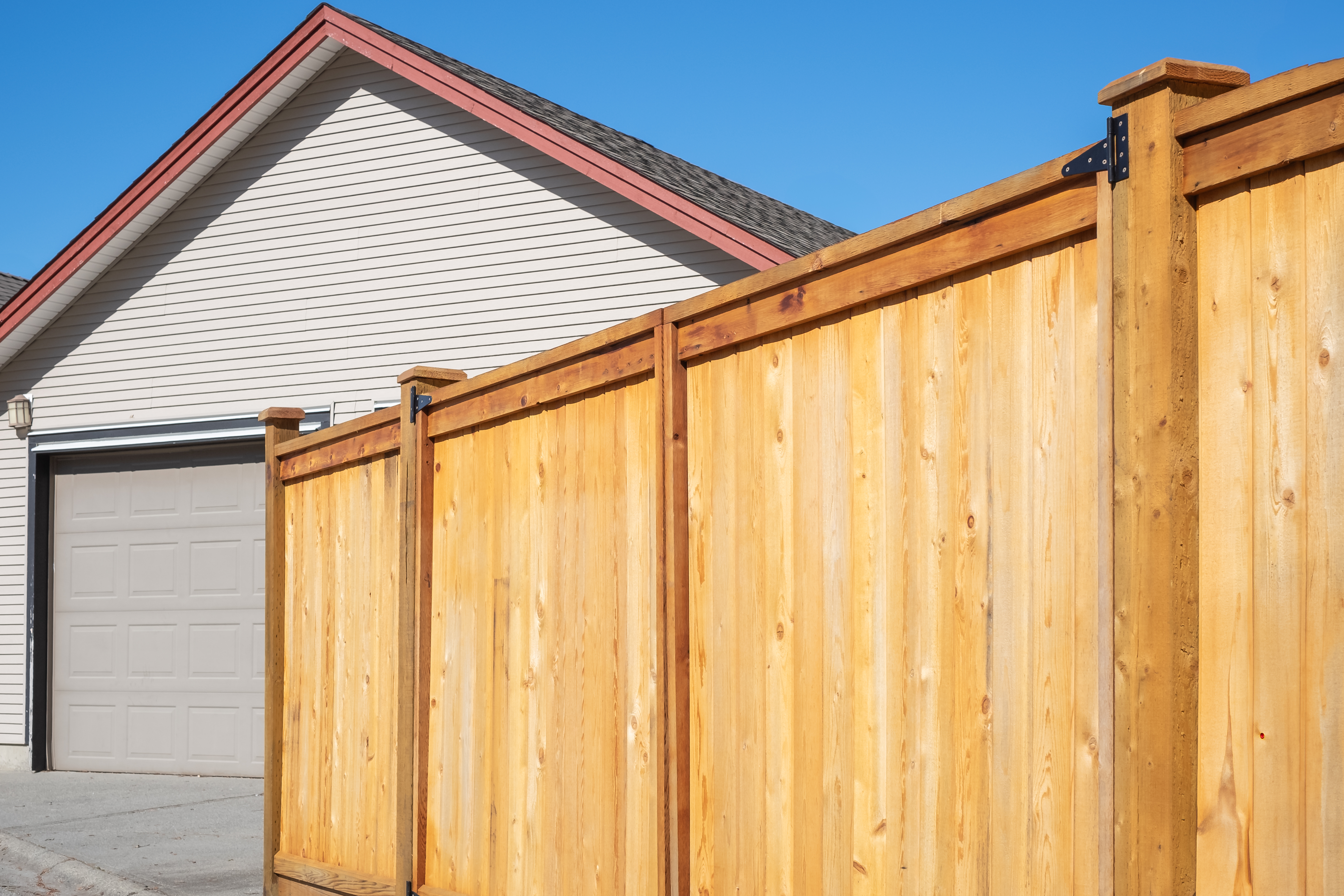 Transformative Fencing Solutions for Peace of Mind 3 wooden fence around house wooden fence on a sunny 539635ed0b644e8baa06