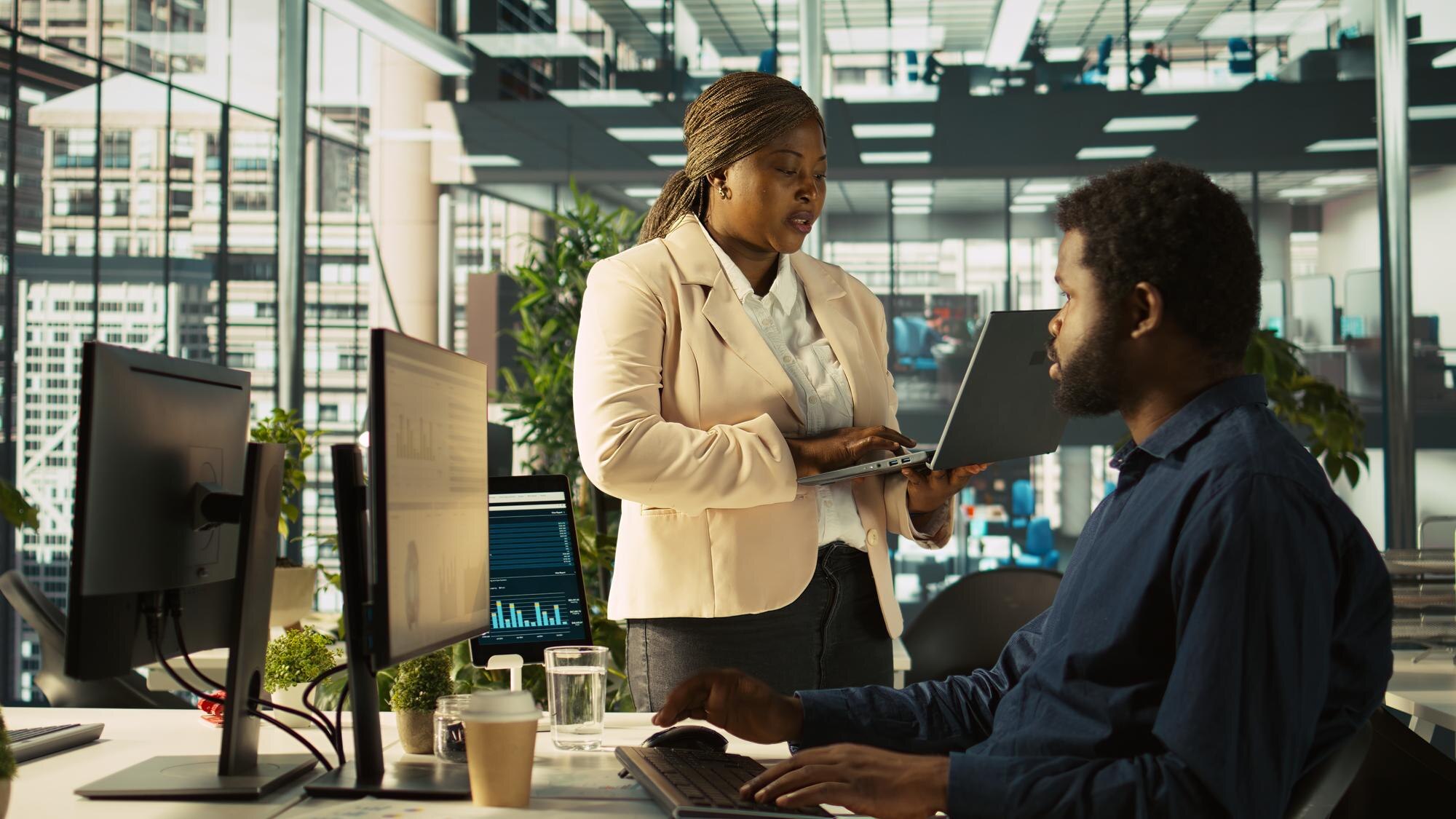 worker in office receiving feedback from managemen 7592329716b9ae6b97f2