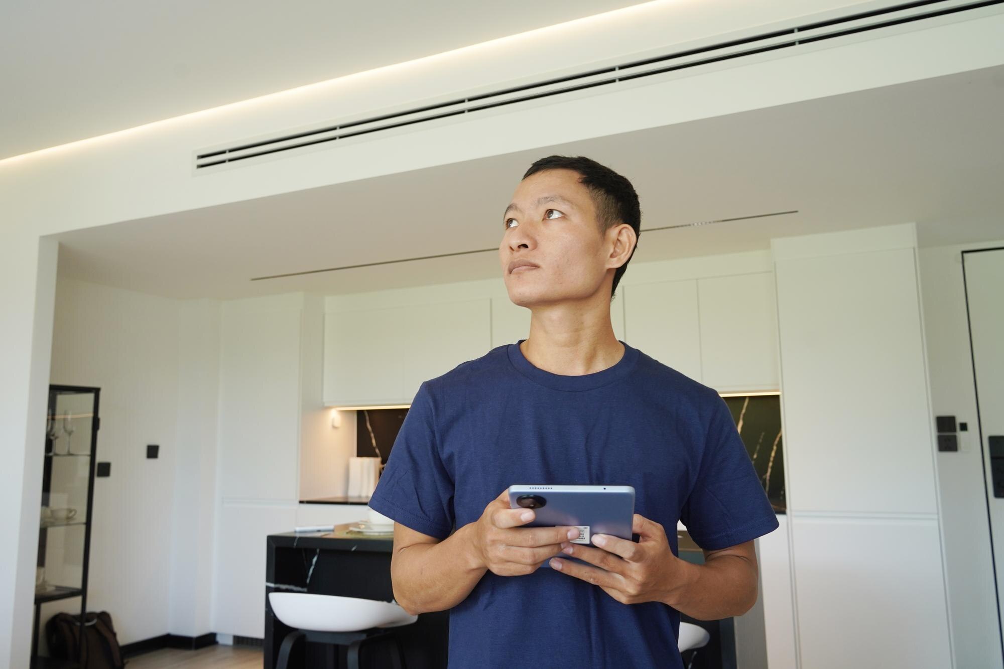 worker with tablet computer checking alarm system a1f2046b222cd5c17aa8