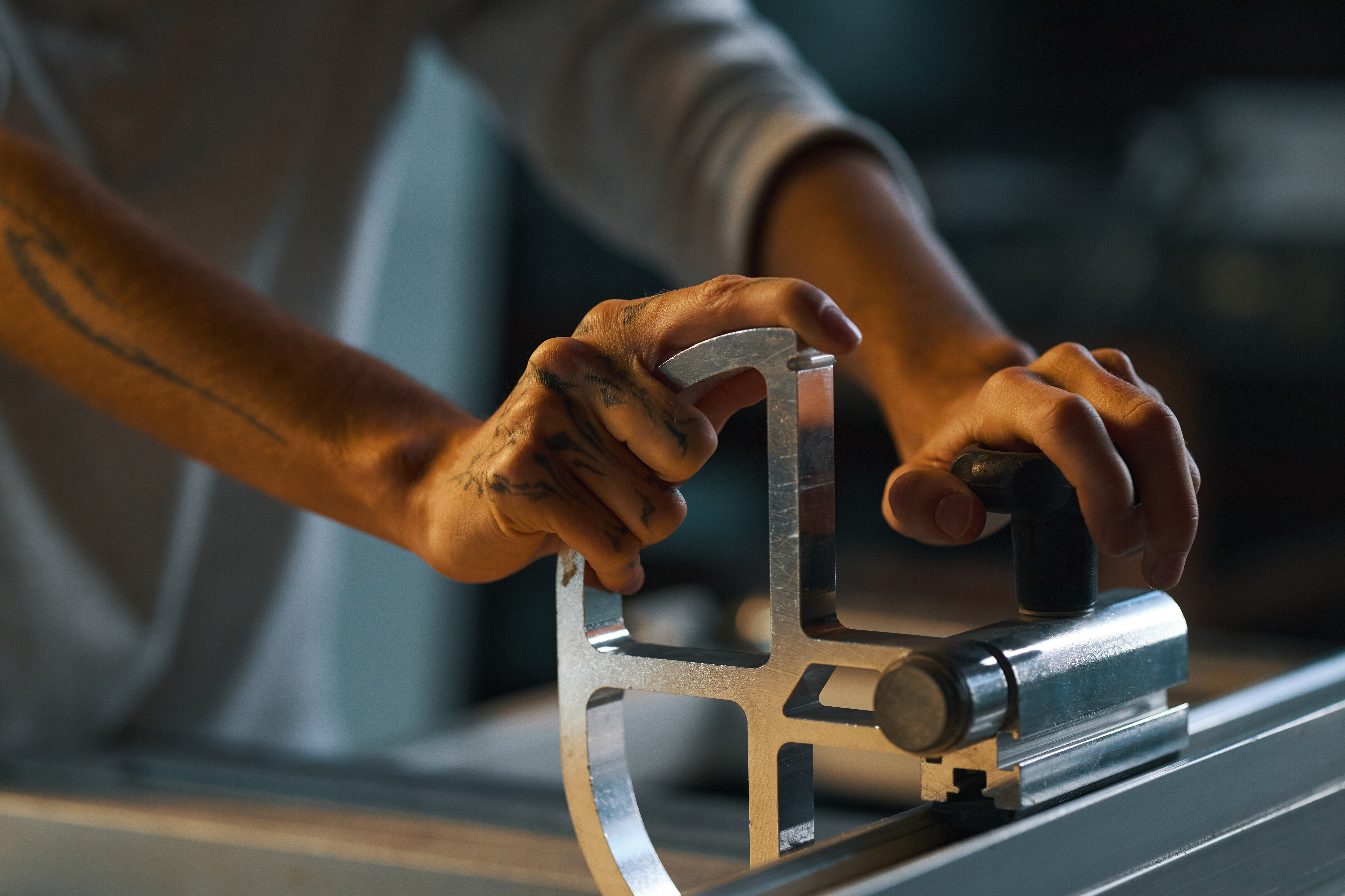 Delivering Precision and Quality: Why Local Plastic Fabrication in Australia Wins 3 worker working on cutting machine in workshop e850de8bf522fafa510a