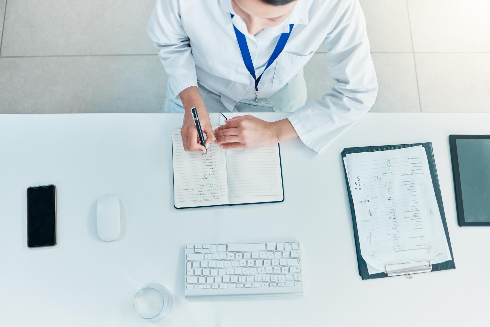 Mastering The Art Of Medical Writing For Oet Success 1 image of a medical professional writing note - illustrative image to describe OET medical writing courses by Accordemy®