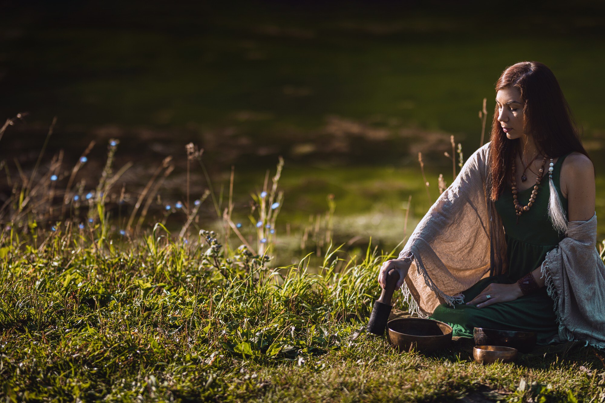 yogi woman sitting in the forest and playing music f75566b4052bc2cc5099