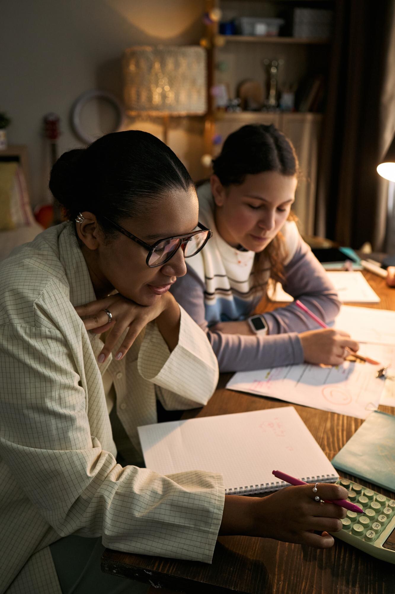 Young Adult Black Woman Assisting Teenage Girl Sol Aba818df4750913eb78b