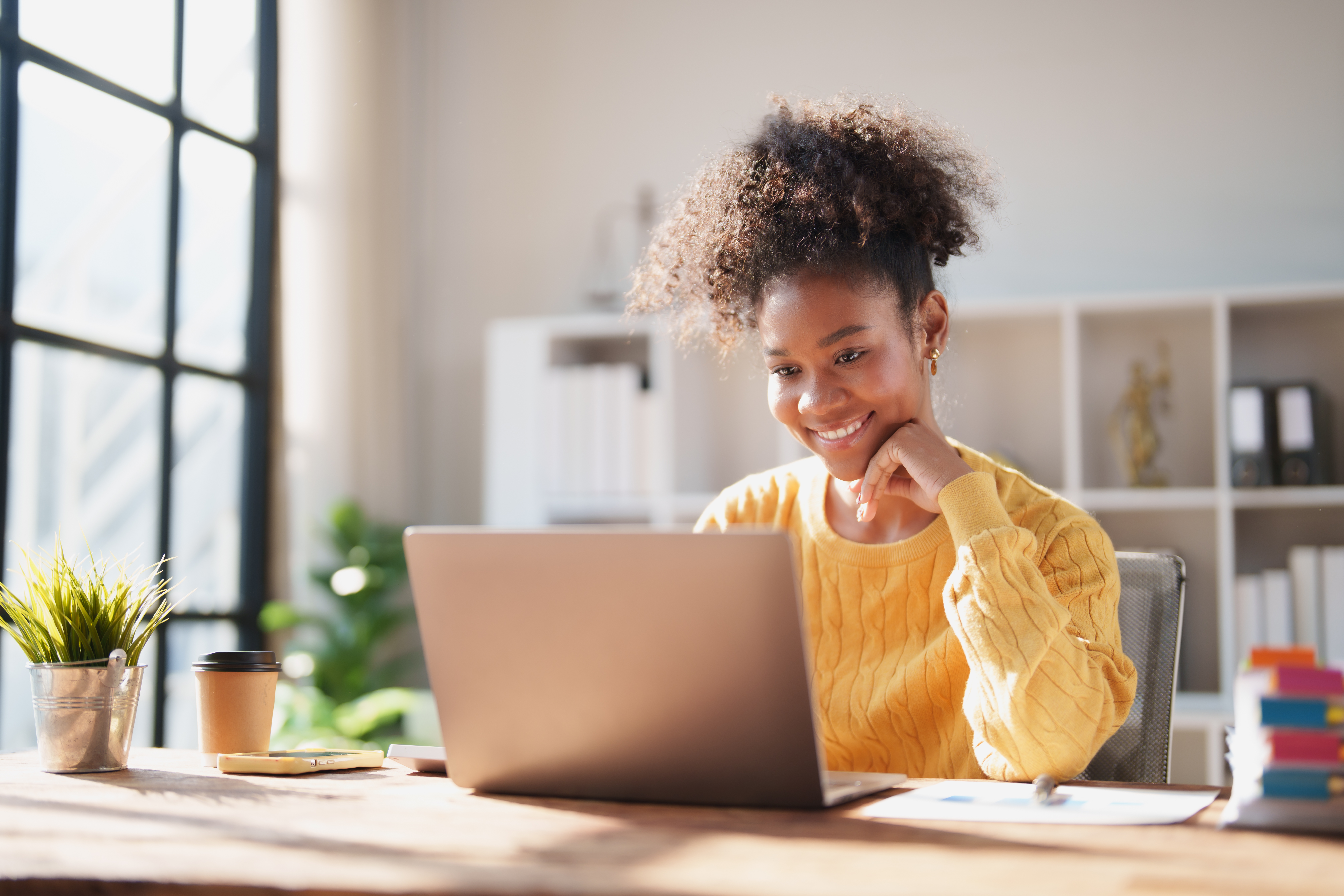 Young African American Woman Working From A Bright Bc158805f0c220648ebb