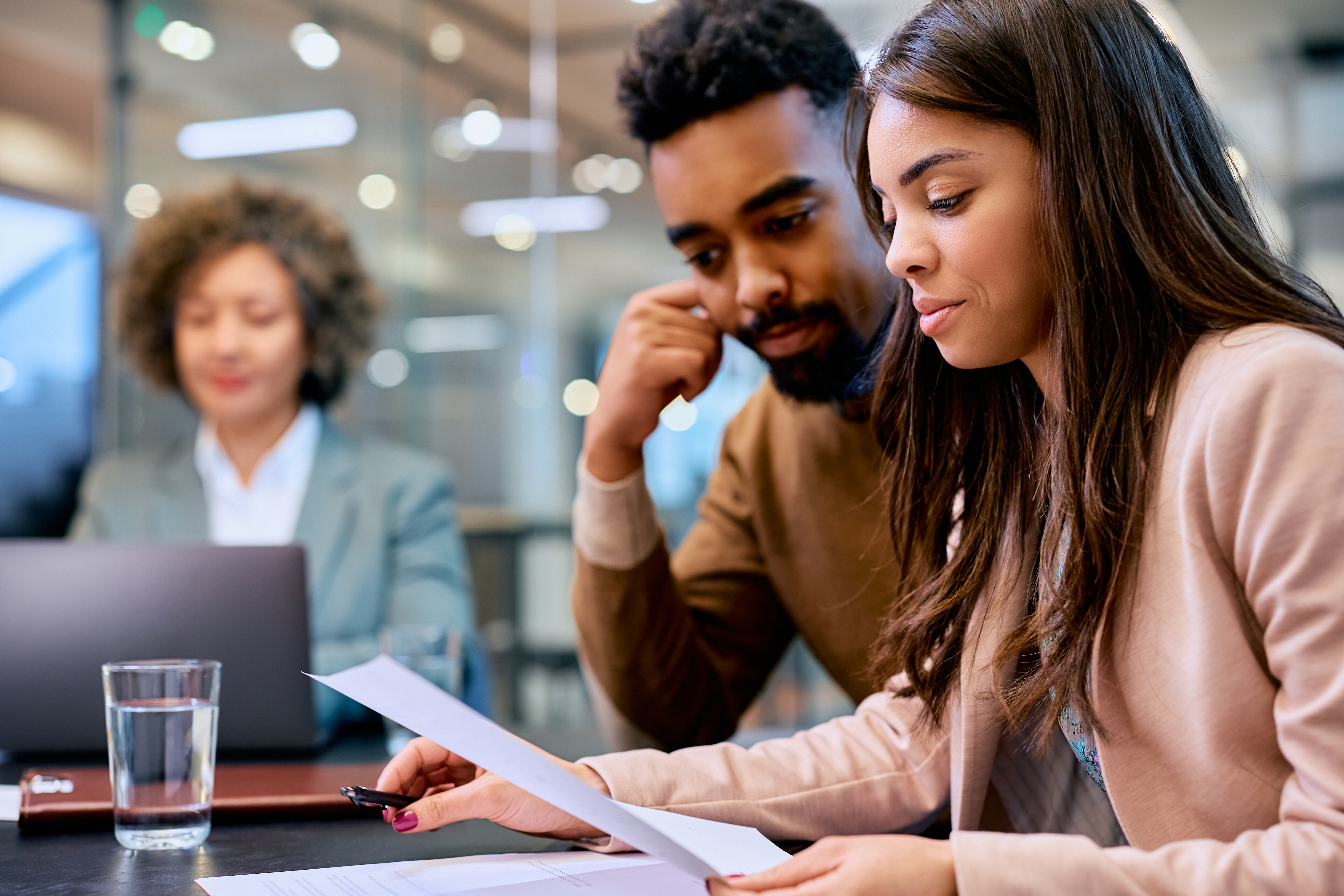 Young Black Couple Analyzing Paperwork During A Me Af8155A8389Edbfe6B19