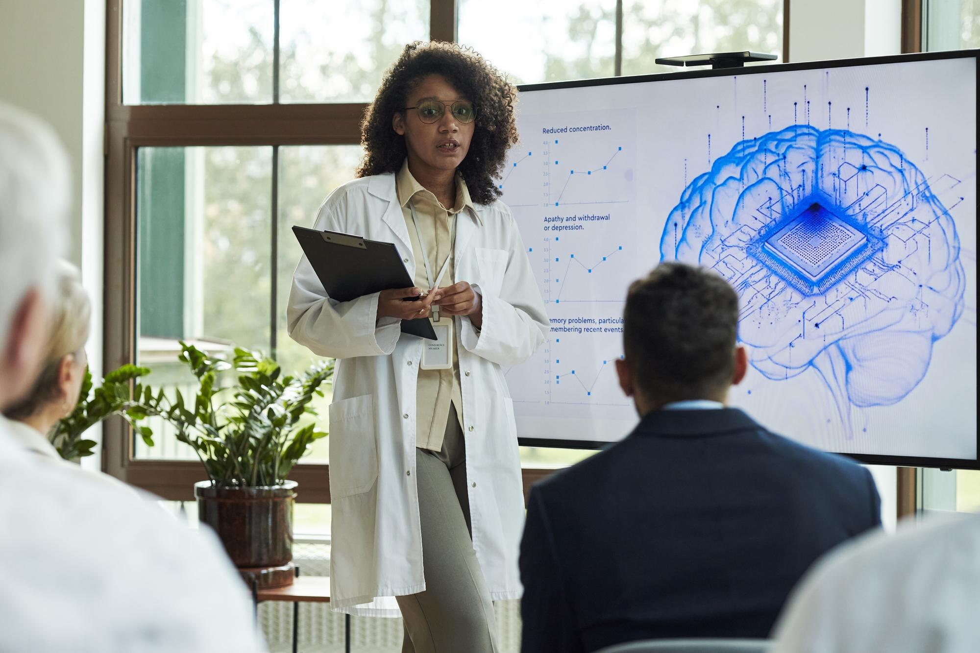 young black woman scientist explaining brain chip fb5cd2c176ab61f72018