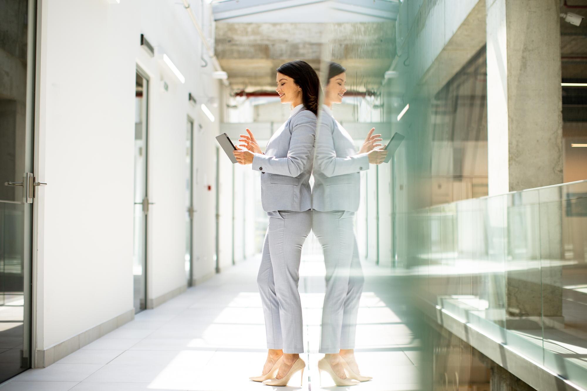 young business woman using mobile phone in the off cd870406ebf1a7cb0f06
