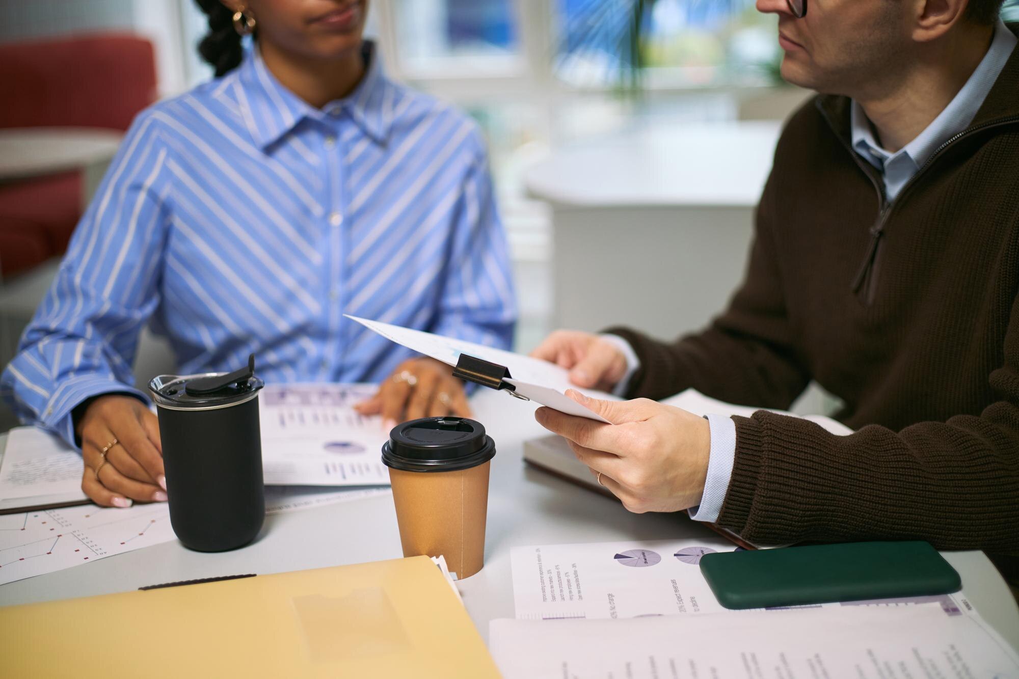 Young Caucasian Man Discussing Documents With Youn 3Be9Fd562B04B6A989Bf