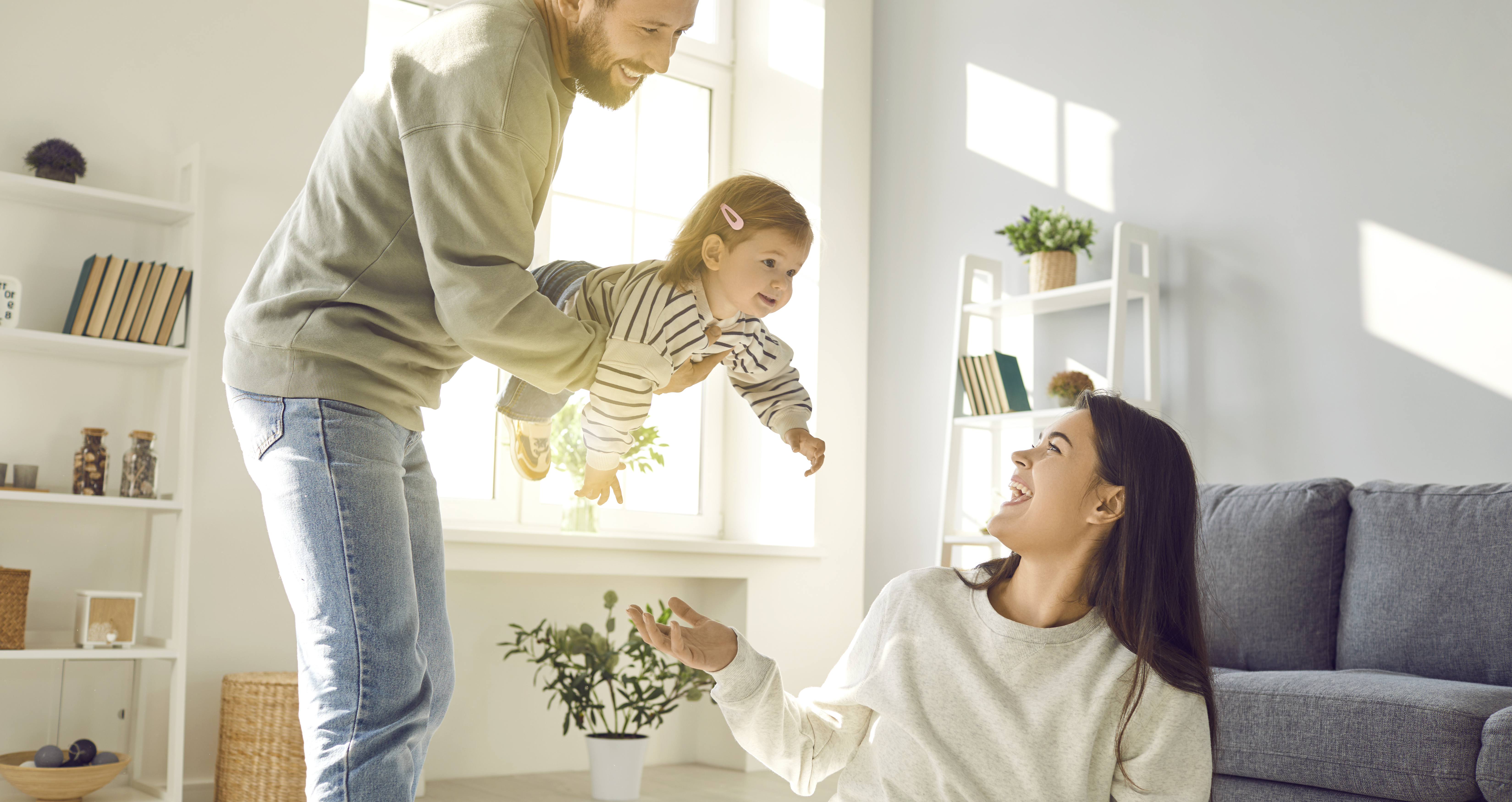 young caucasian parents are playing and having fun 3cccd51fb130e3f68de4