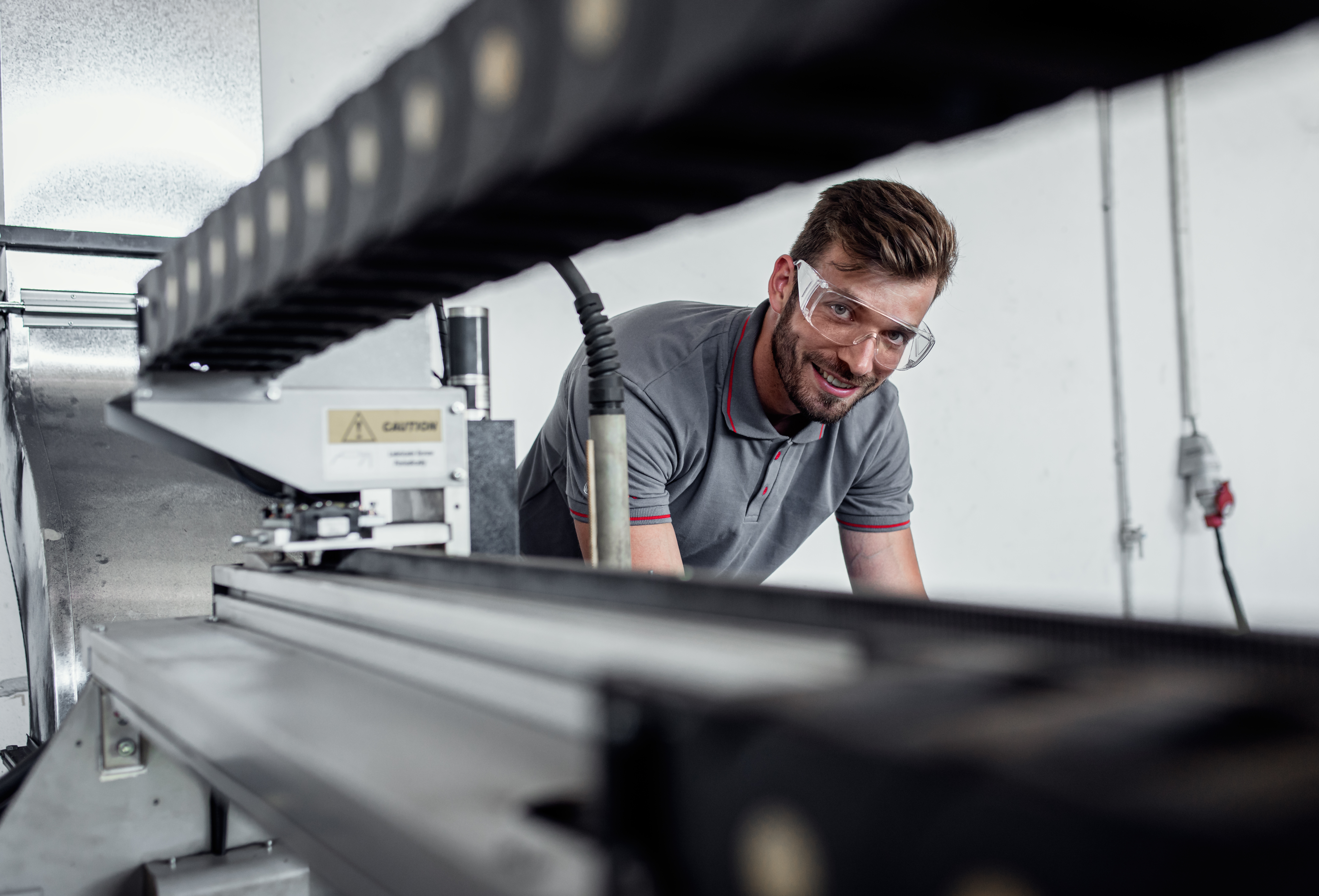 How Expert Plastic Fabrication Advice Reduces Project Risk 1 young engineer setup plasma cutter for work in met 4a8711a5e6767c164896