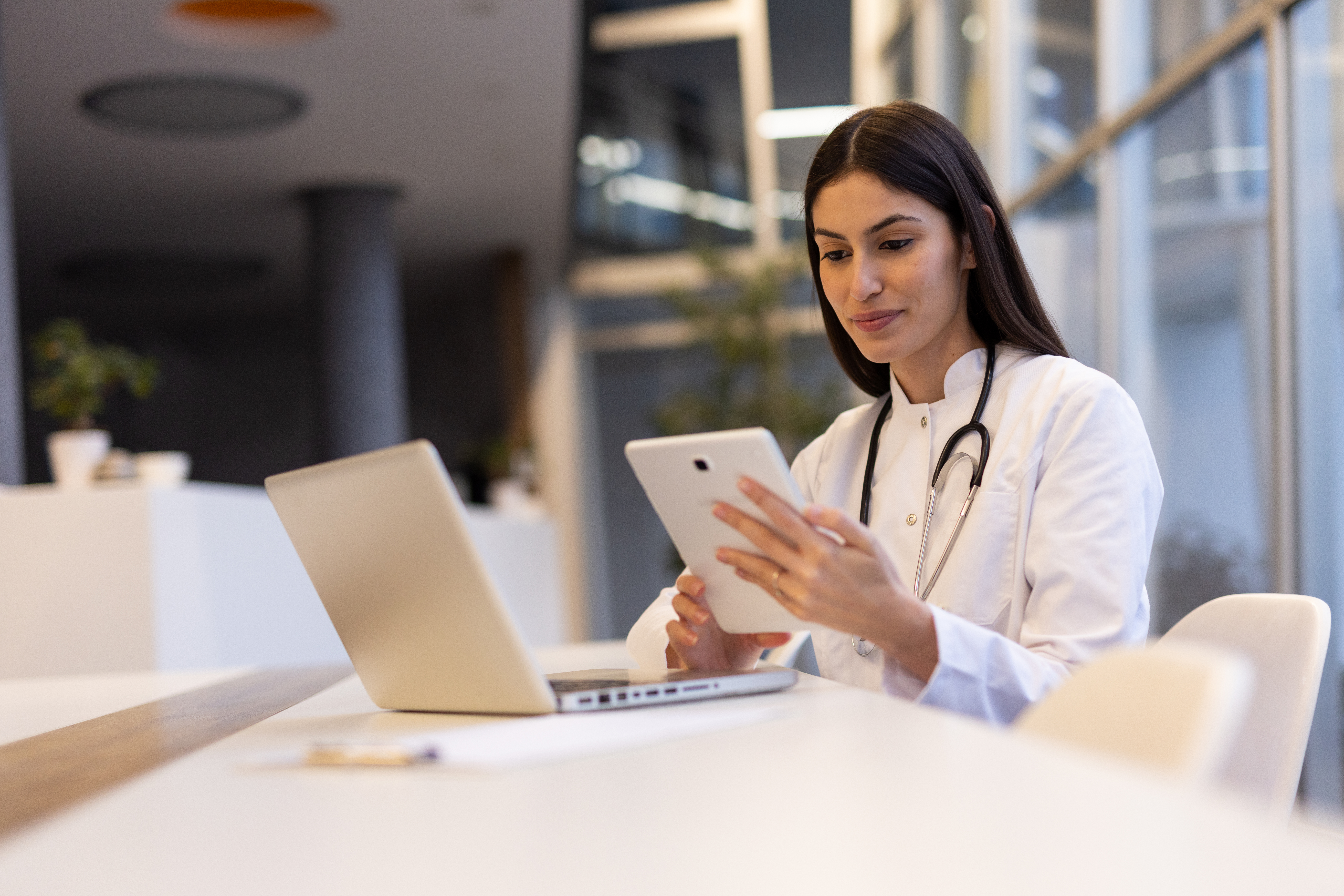 Building a Strong Visual Identity for Wellness Professionals 3 - MedWell Digital Marketing Agency young female doctor engaging with a digital tablet f93804b15ca311ccce5e - MedWell Digital Marketing Agency