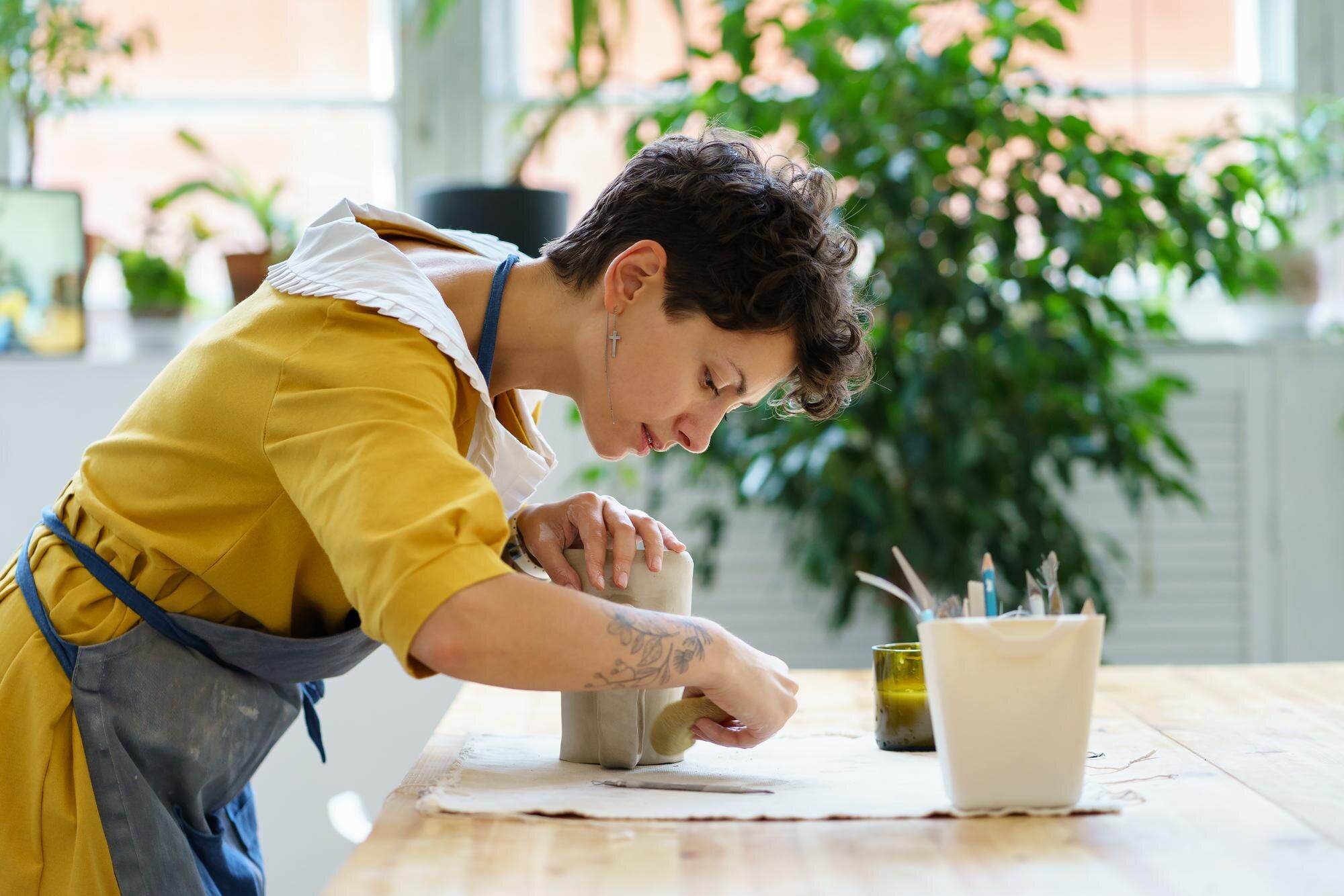 Practical plastics that help DIYers and tradies get better results with less waste 2 young girl artisan busy with modeling jug from raw a6b1eb179e6c1d5f8dad