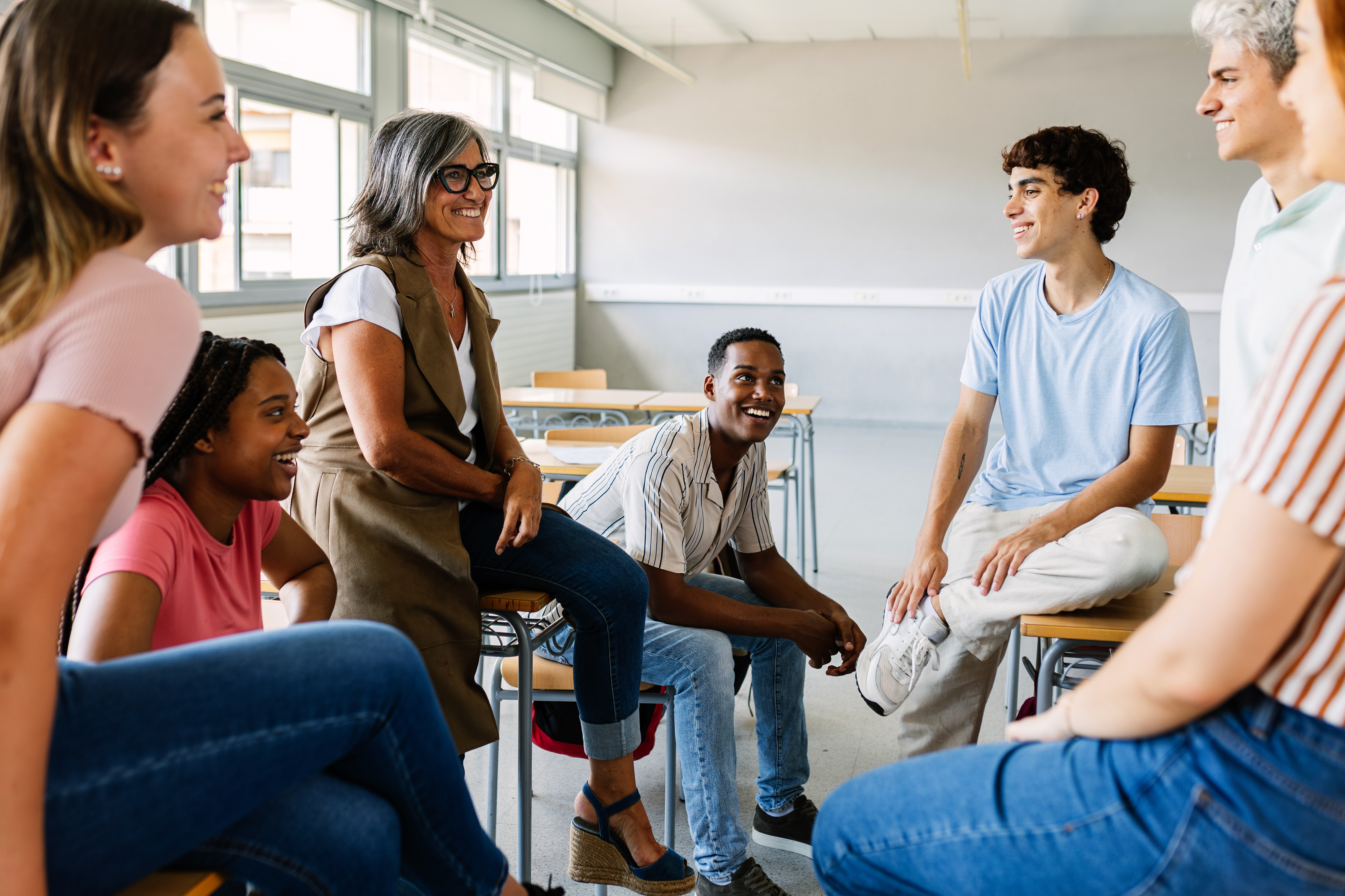 young group of high school students talking with m e85081103c23bbb6dcd8