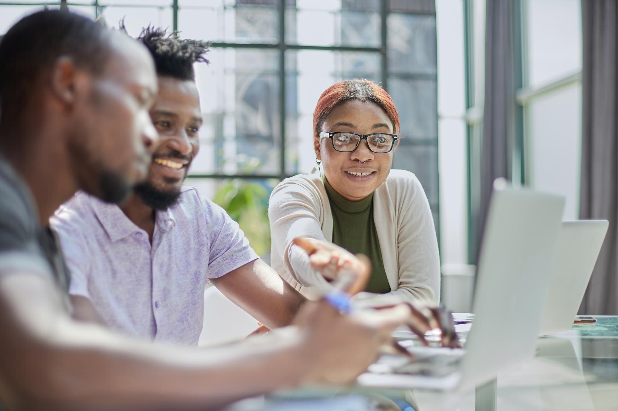 young guy uses the phone while sitting at the tabl 1f37e14afa1d6841d03f
