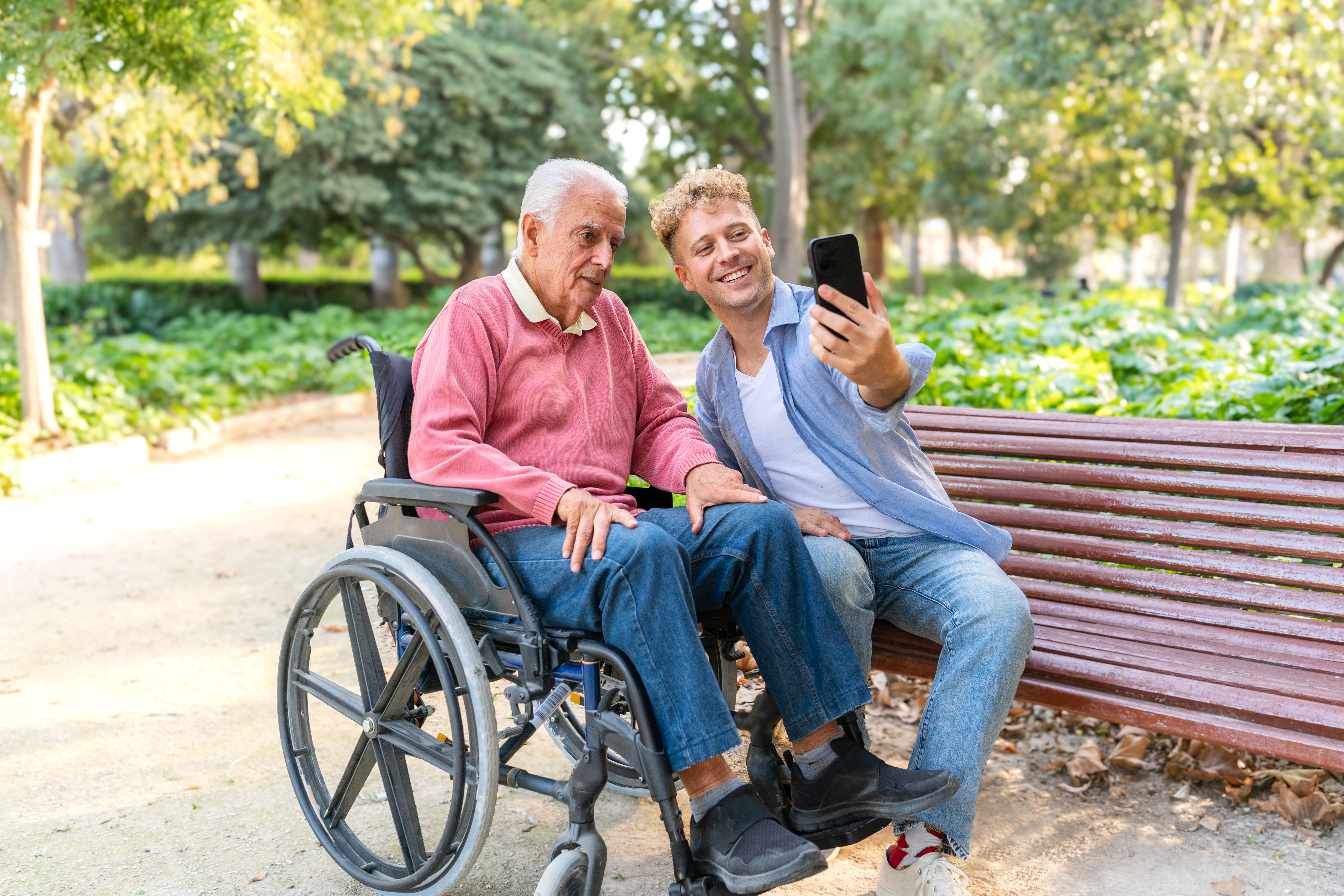 young man and senior grandfather in wheelchair tak 5ab2c9d845228954f6e6