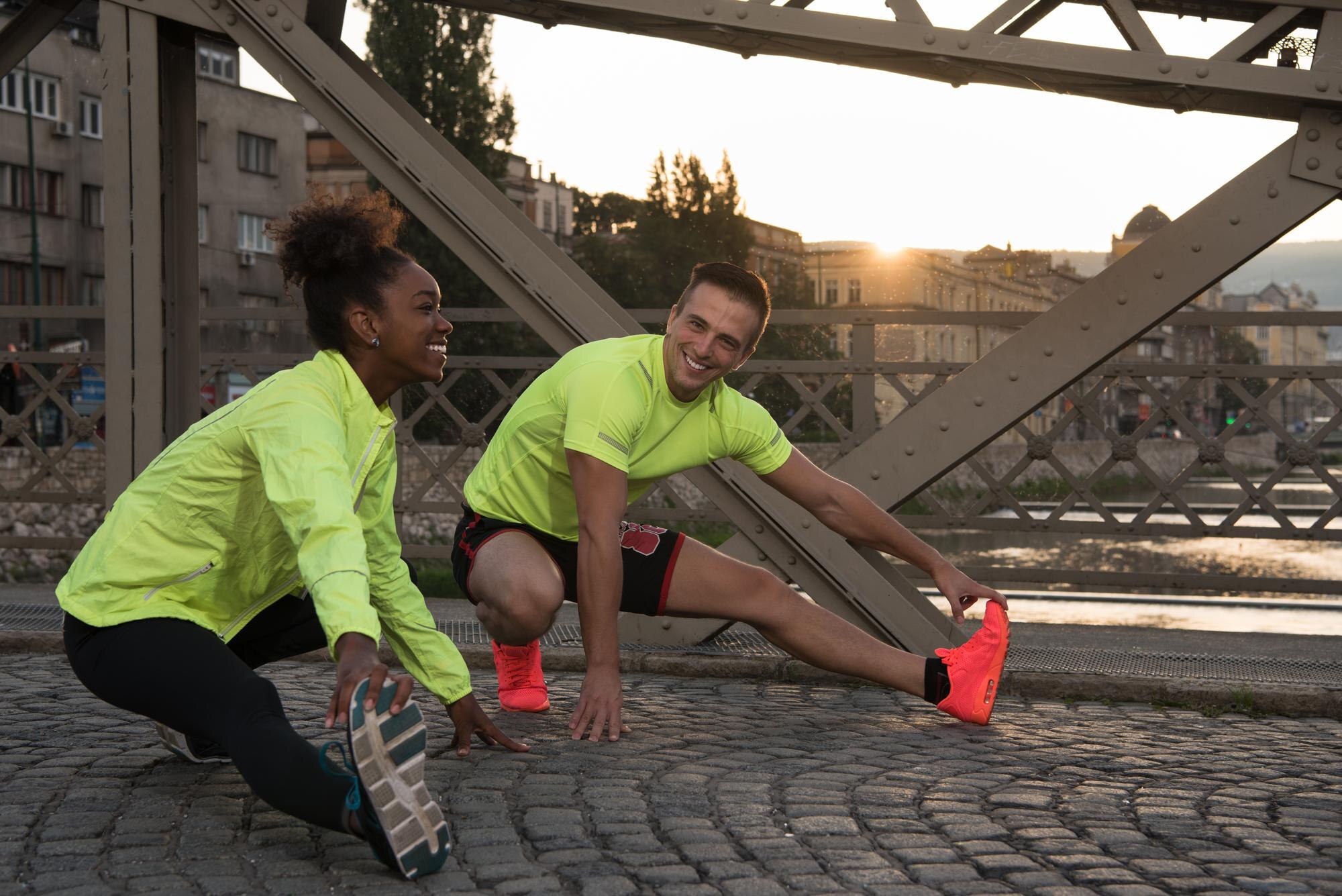 young multiethnic jogging couple warming up and st 3c01cf686f7b9acb7600