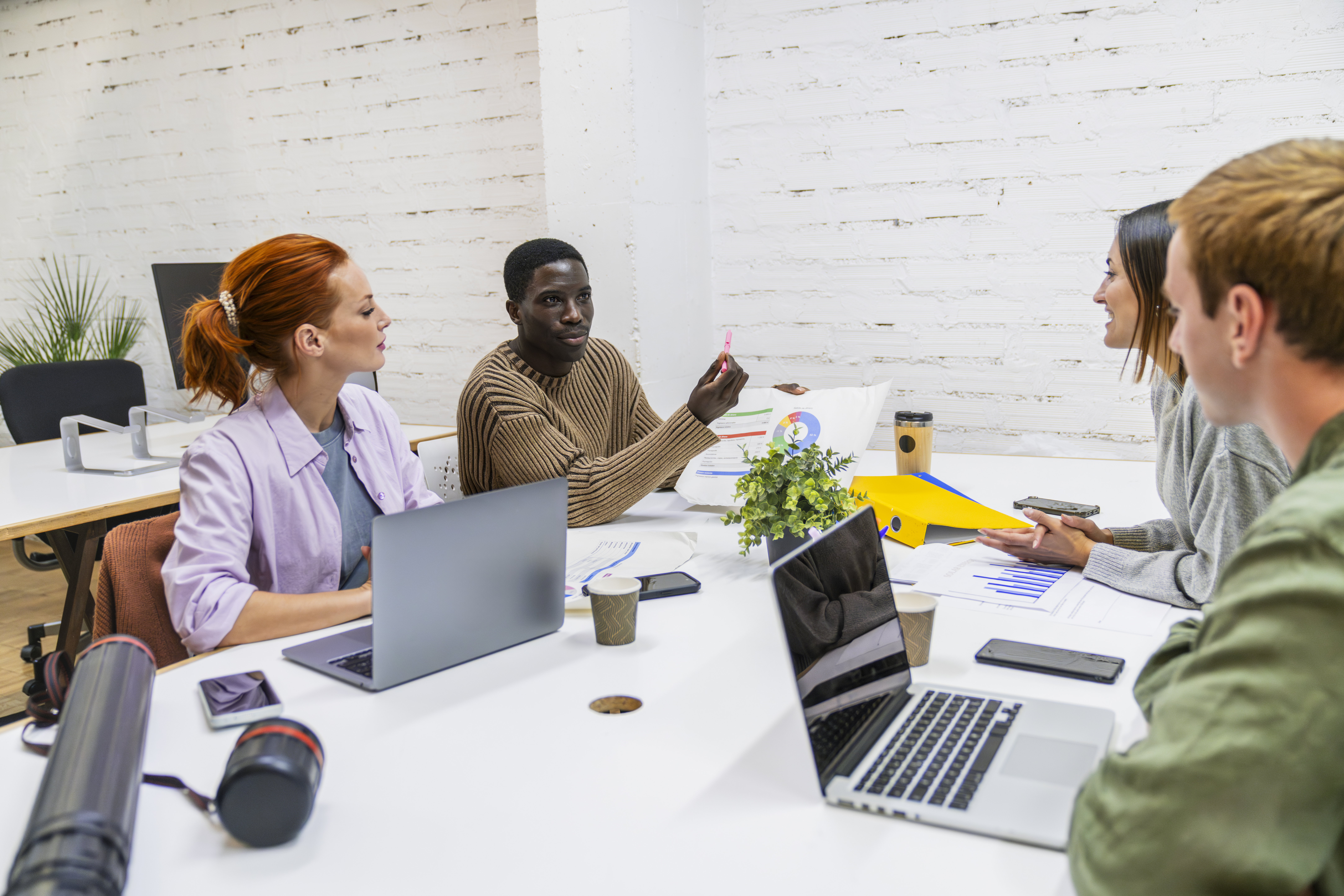 young multiethnic team discussing charts in cowork 45152da8511b9de58537