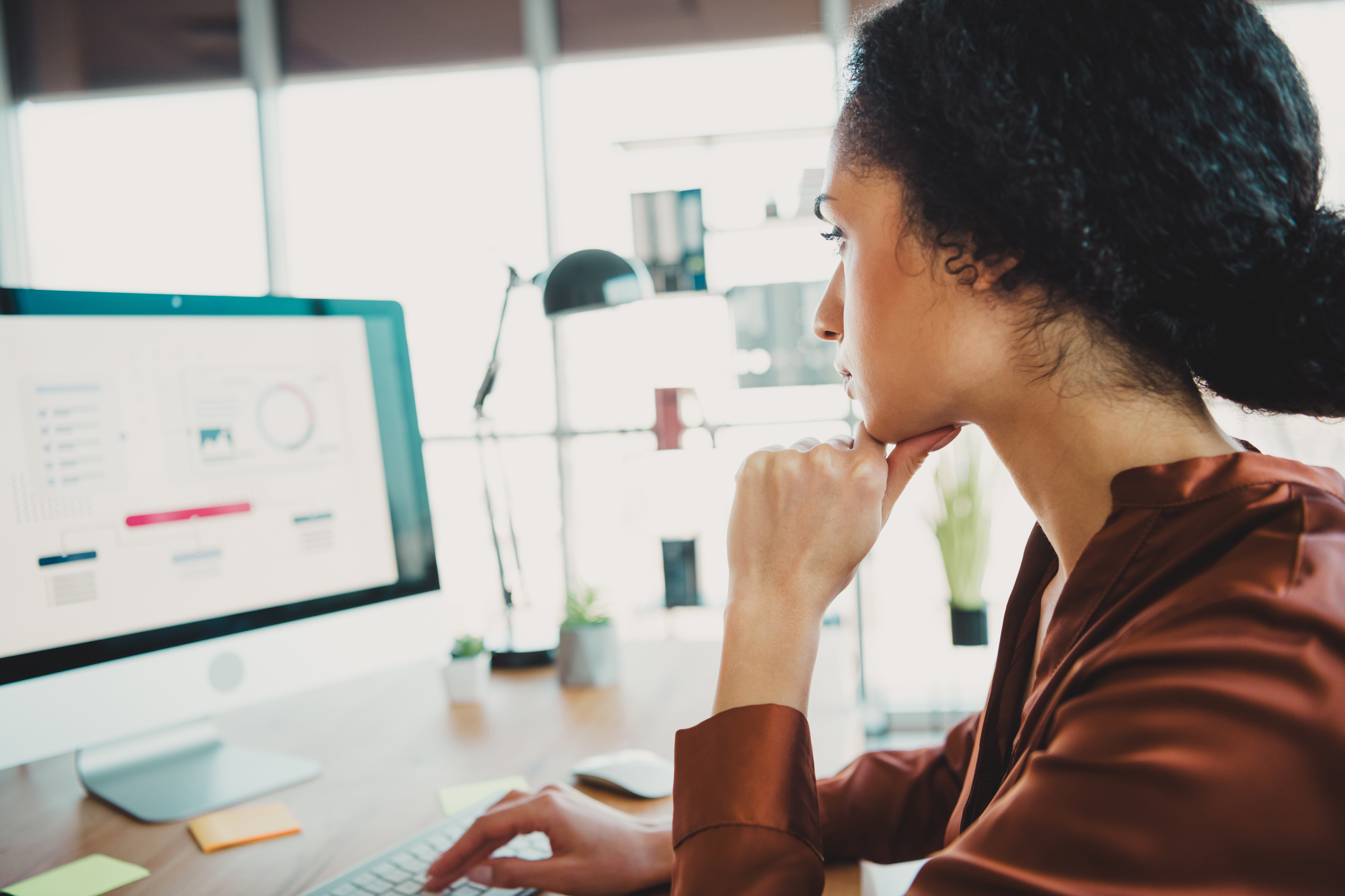 Featured image: Young professional woman working in an office with-ad2e4eadd102506248bd