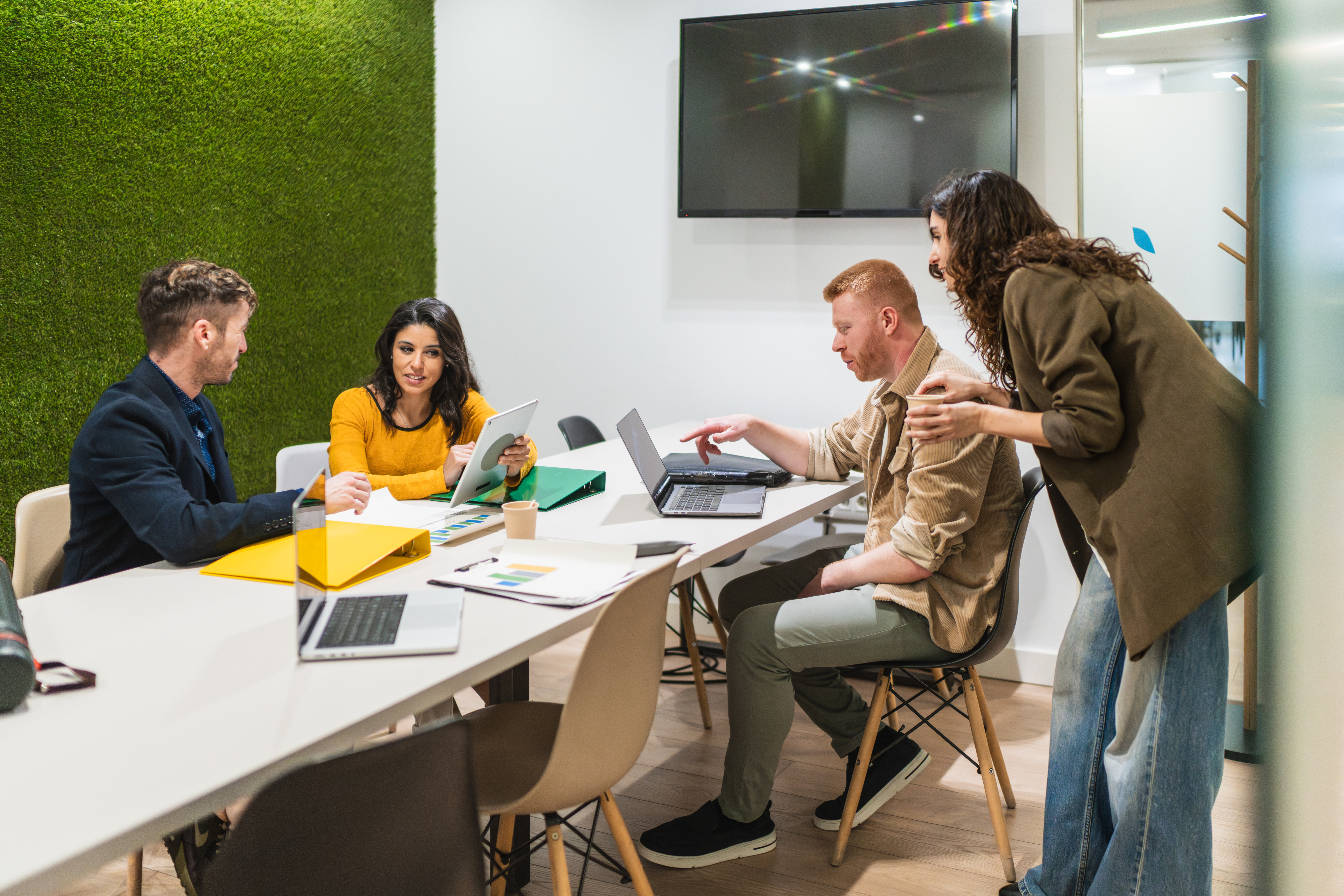 young professionals collaborating on project in mo ef35986fa79105ae1694