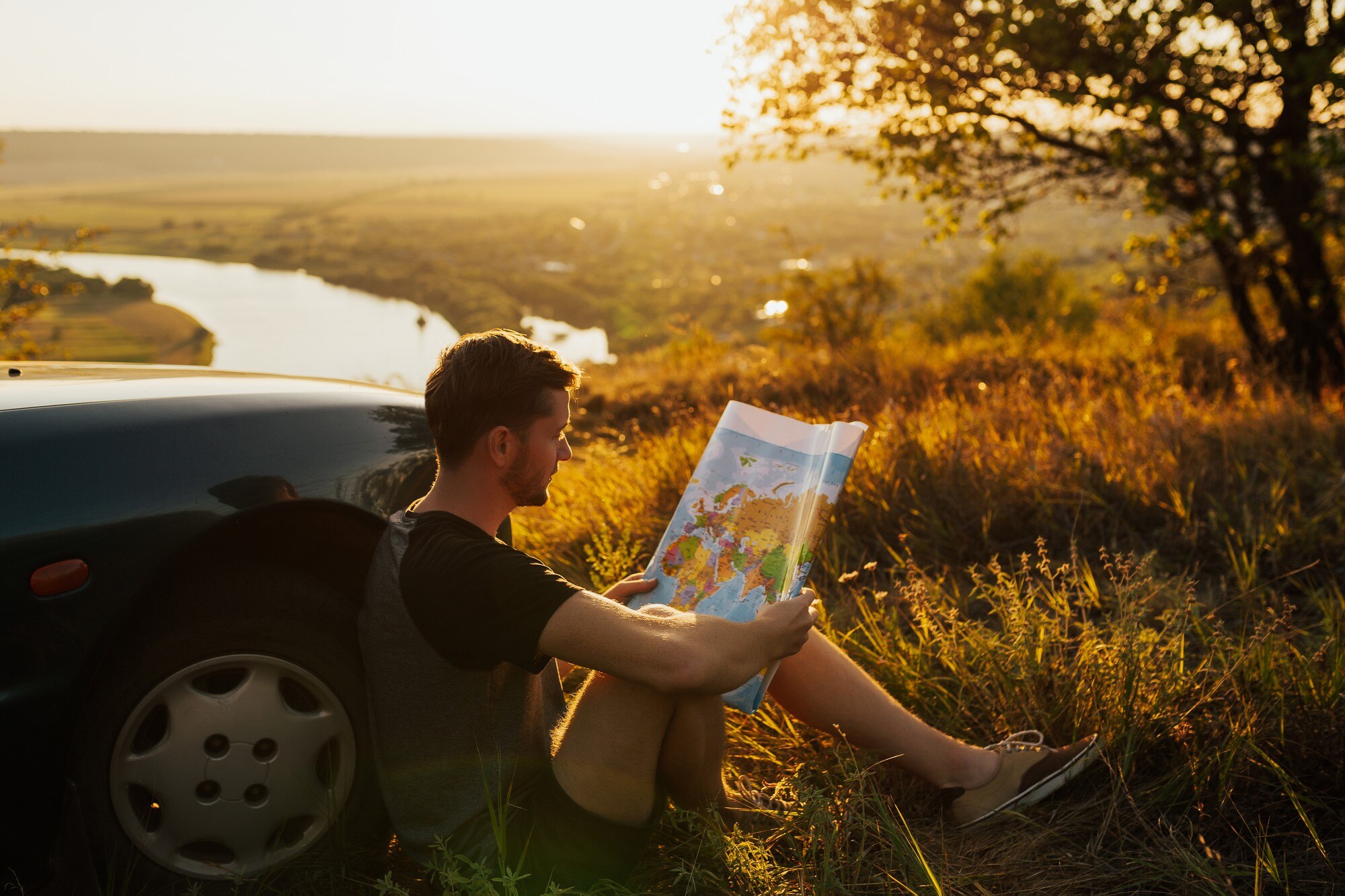 young stylish man holding the map near his car on 0dd780726bc5bc2b9f33 BTOURS